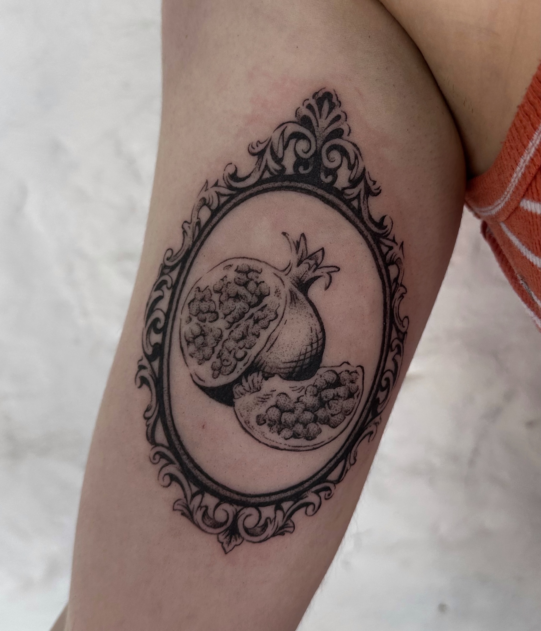 Pomegranate black and grey tattoo on the forearm by Micky, Austin, Texas