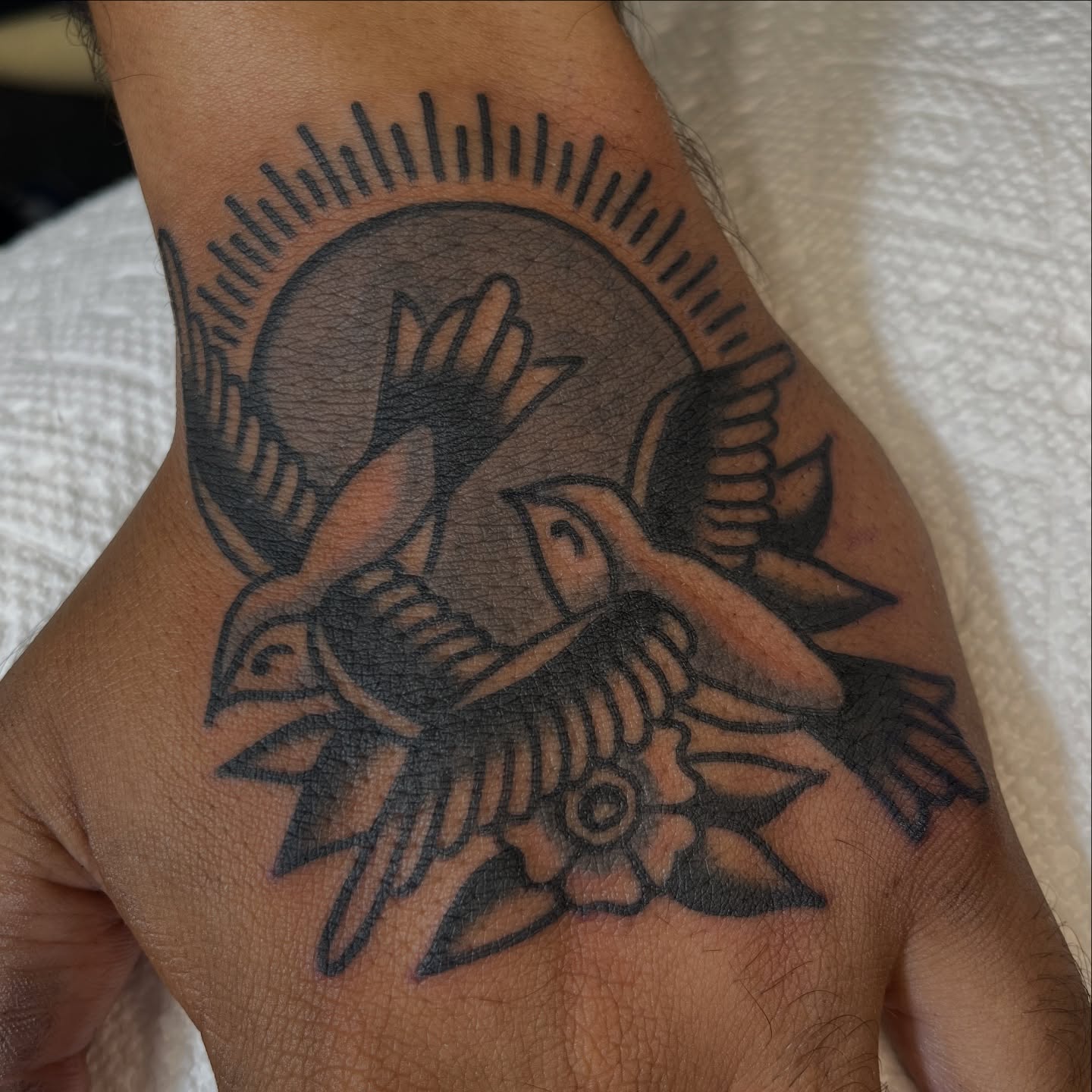 Birds and flower American traditional tattoo on the forearm by Jeff Riley ✞
