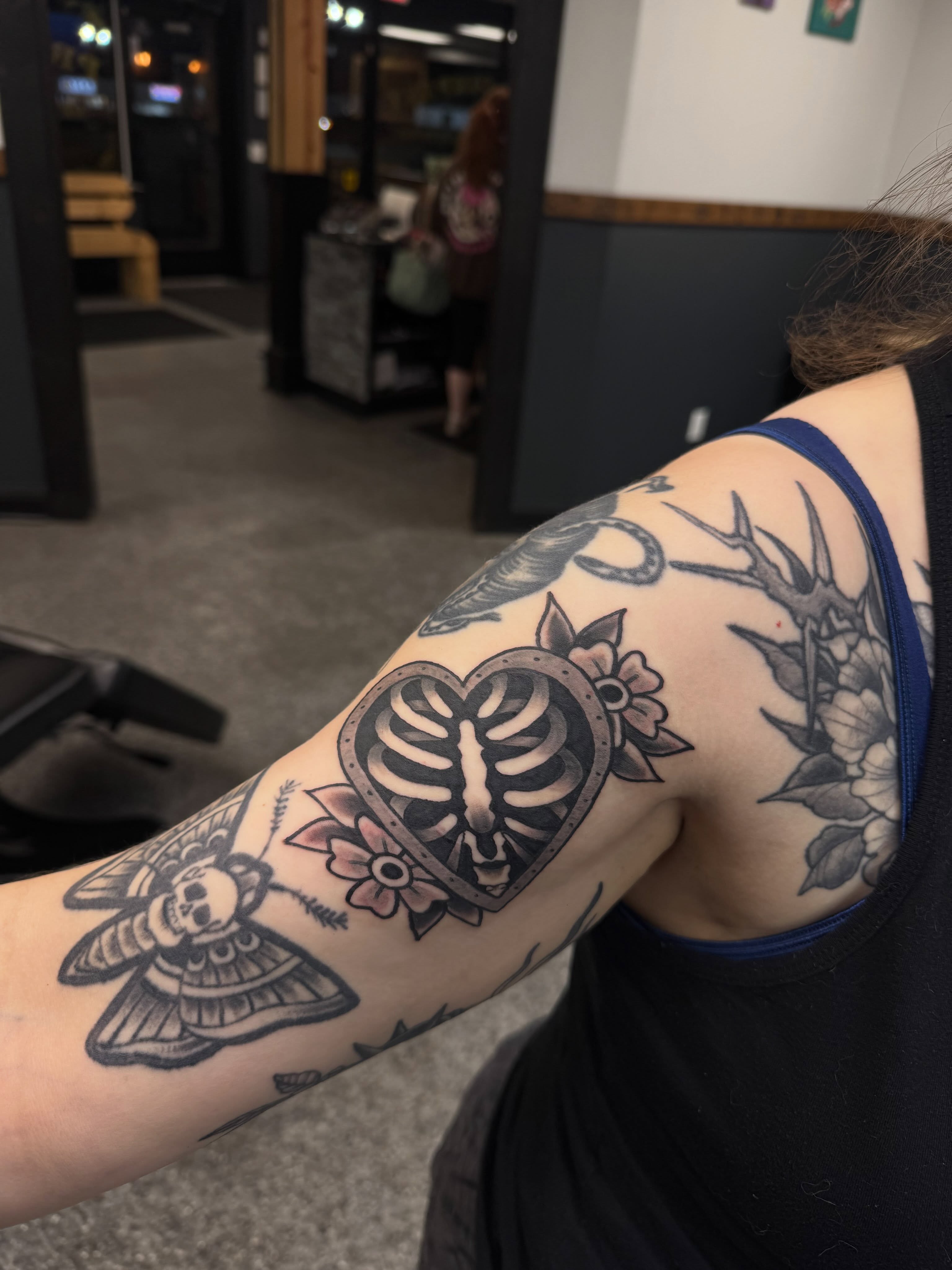 Mask and moth American traditional tattoo on the forearm by “tatsbysabby”