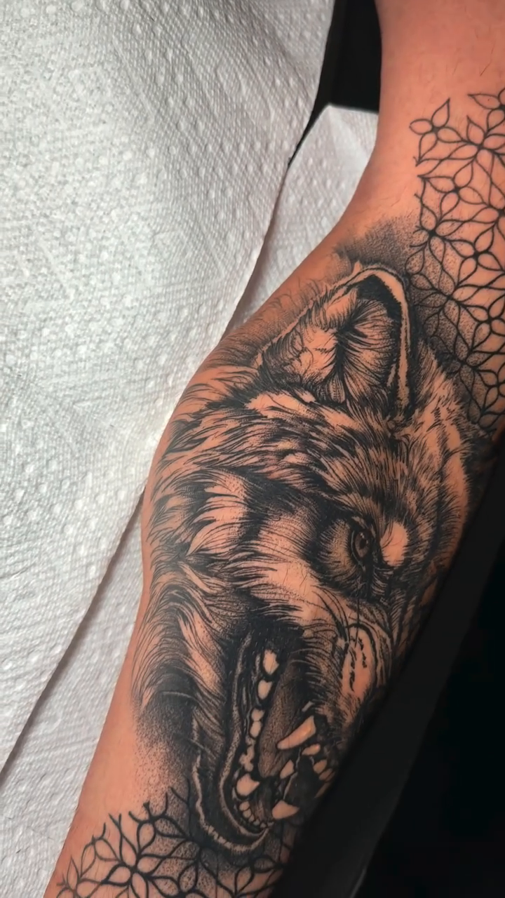 Wolf head with geometric pattern realism tattoo by David Mushaney