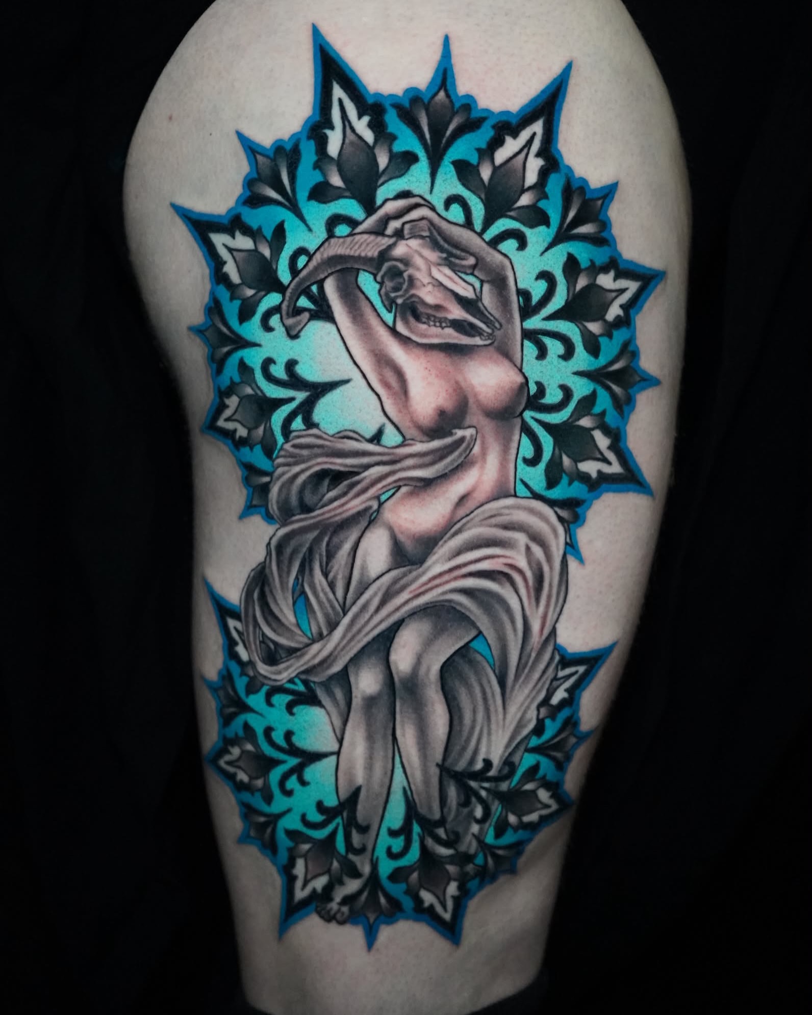 Woman with scarf realism tattoo on the thigh by Gina Carlson