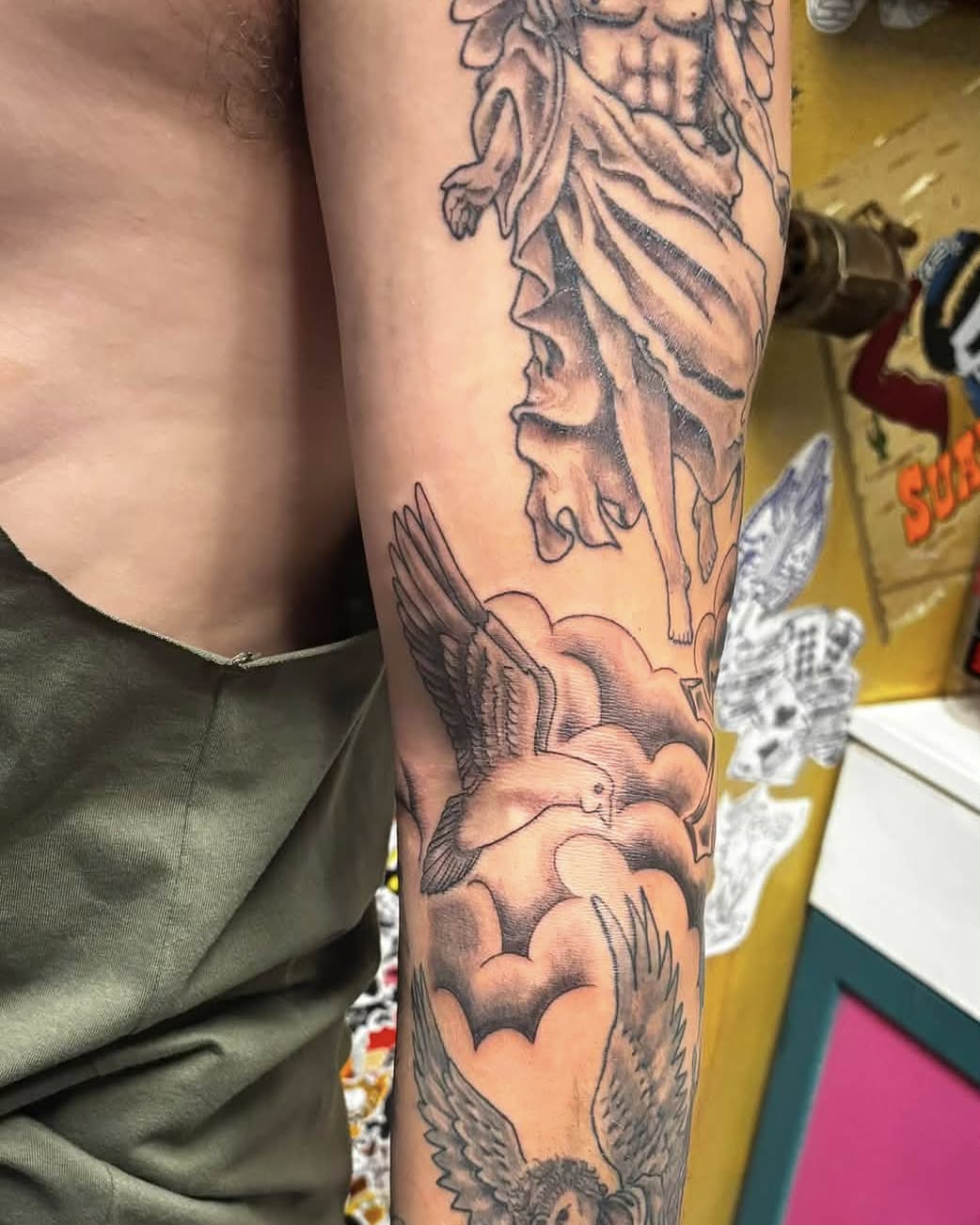Statue and bird American traditional tattoo on the forearm by Jeff Zuptich