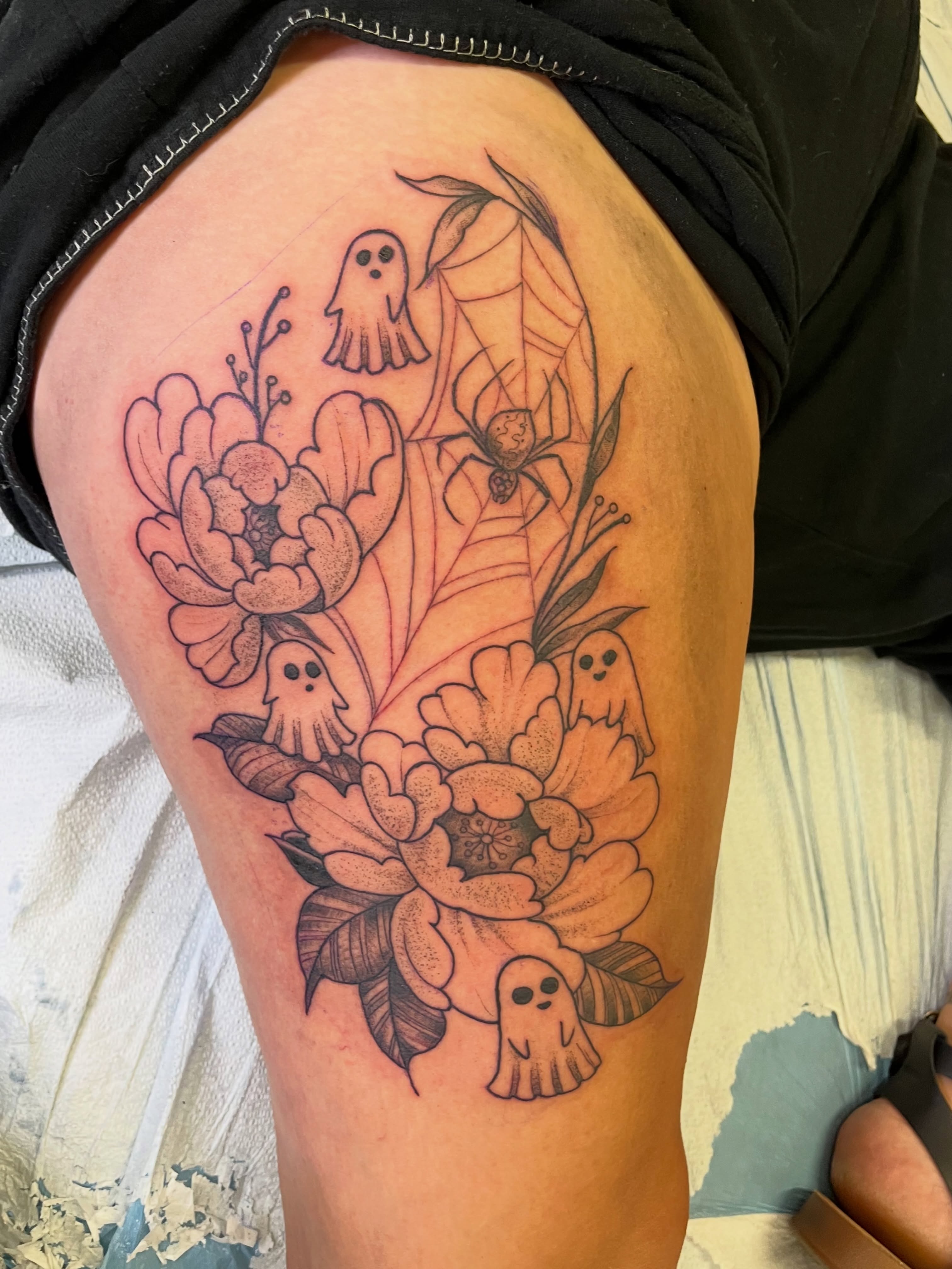 Ghosts and flowers black and grey tattoo on the thigh by Lacey B, Portland, Oregon