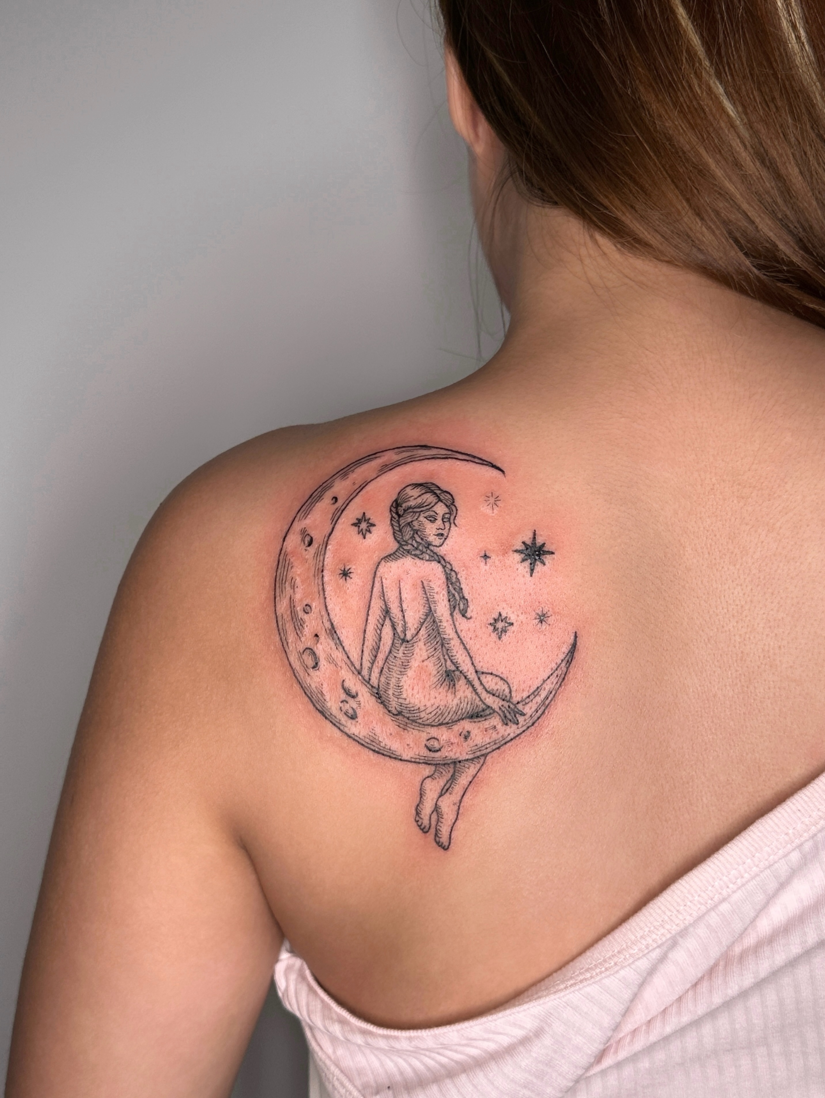 Woman on crescent moon black and grey tattoo on the shoulder by Zecember
