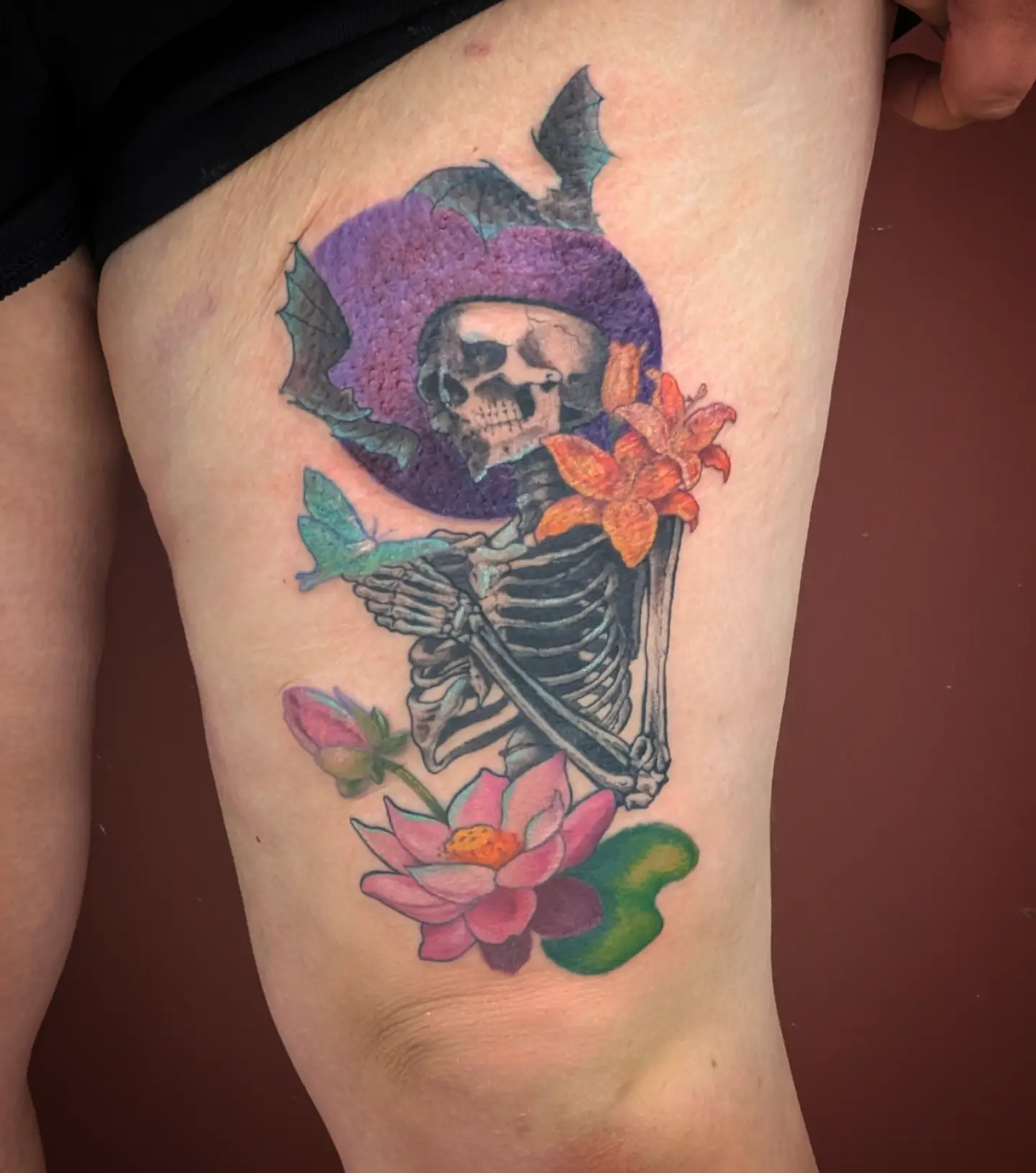Skeleton with flowers new school tattoo on the thigh by Jo Xylo - Minneapolis Tattoo Artist, Minneapolis, Minnesota