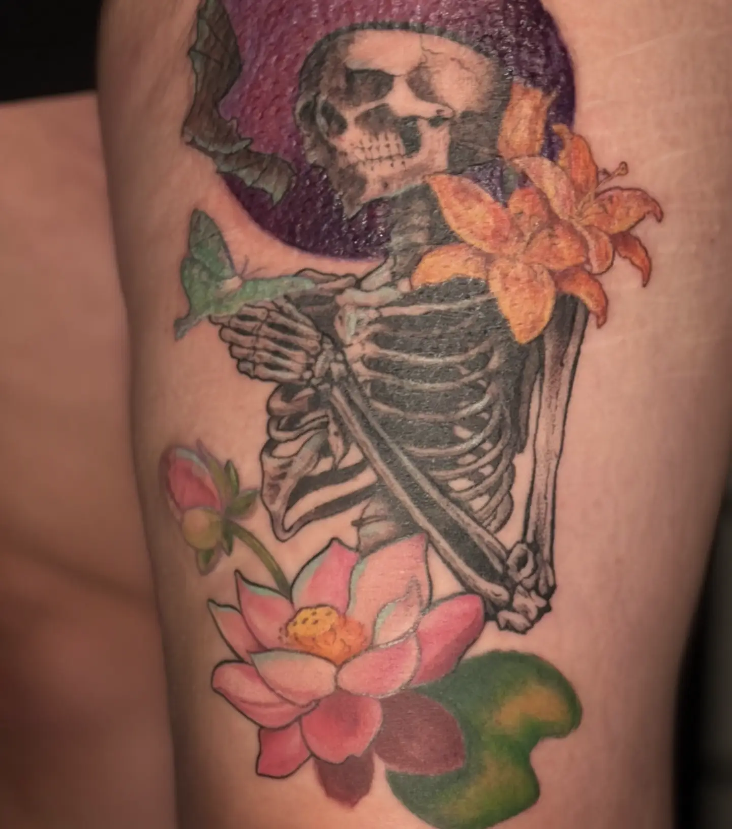 Skeleton with flowers realism tattoo on the thigh by Jo Xylo - Minneapolis Tattoo Artist, Minneapolis, Minnesota