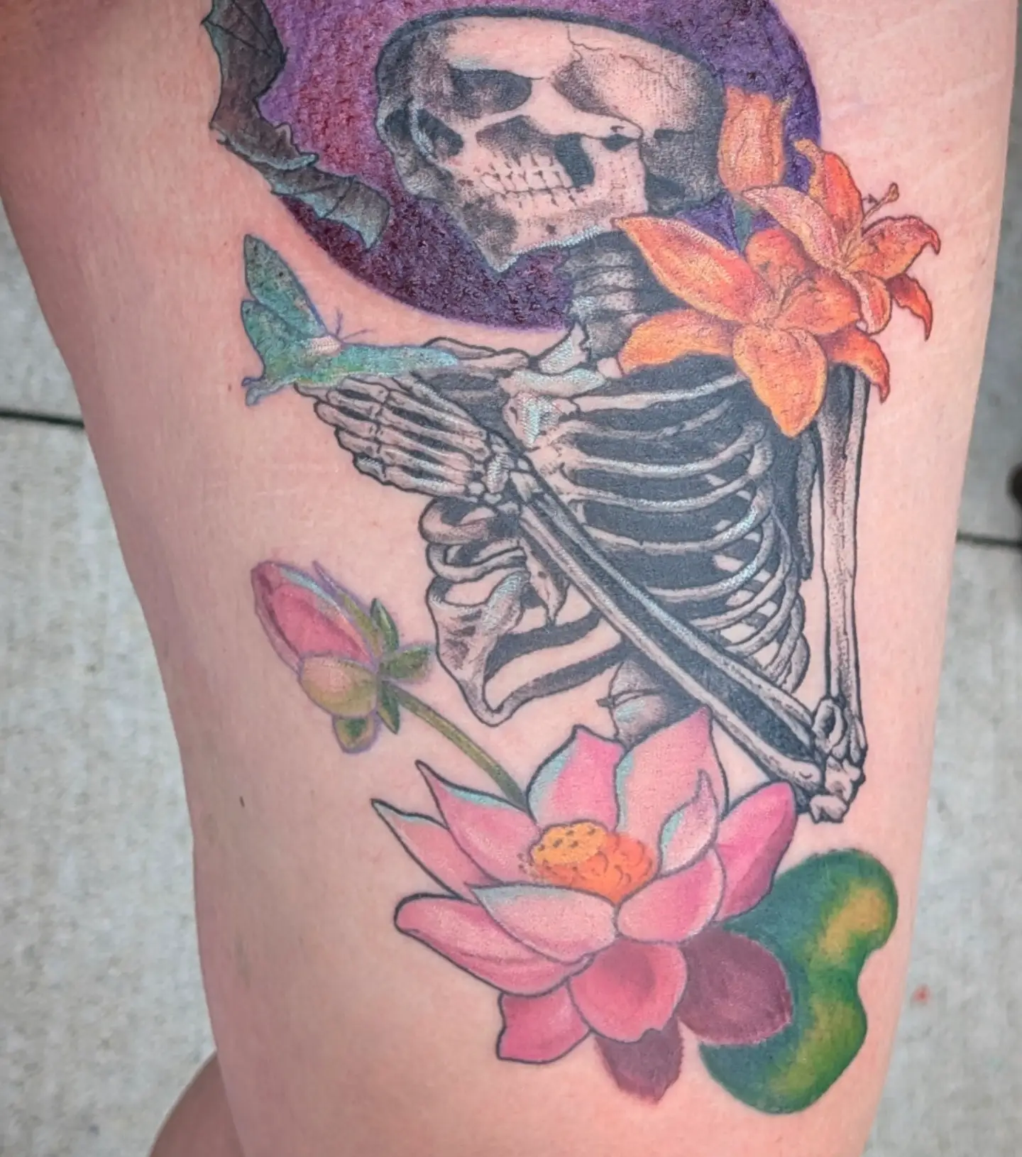 Skeleton with flowers American traditional tattoo on the thigh by Jo Xylo - Minneapolis Tattoo Artist, Minneapolis, Minnesota
