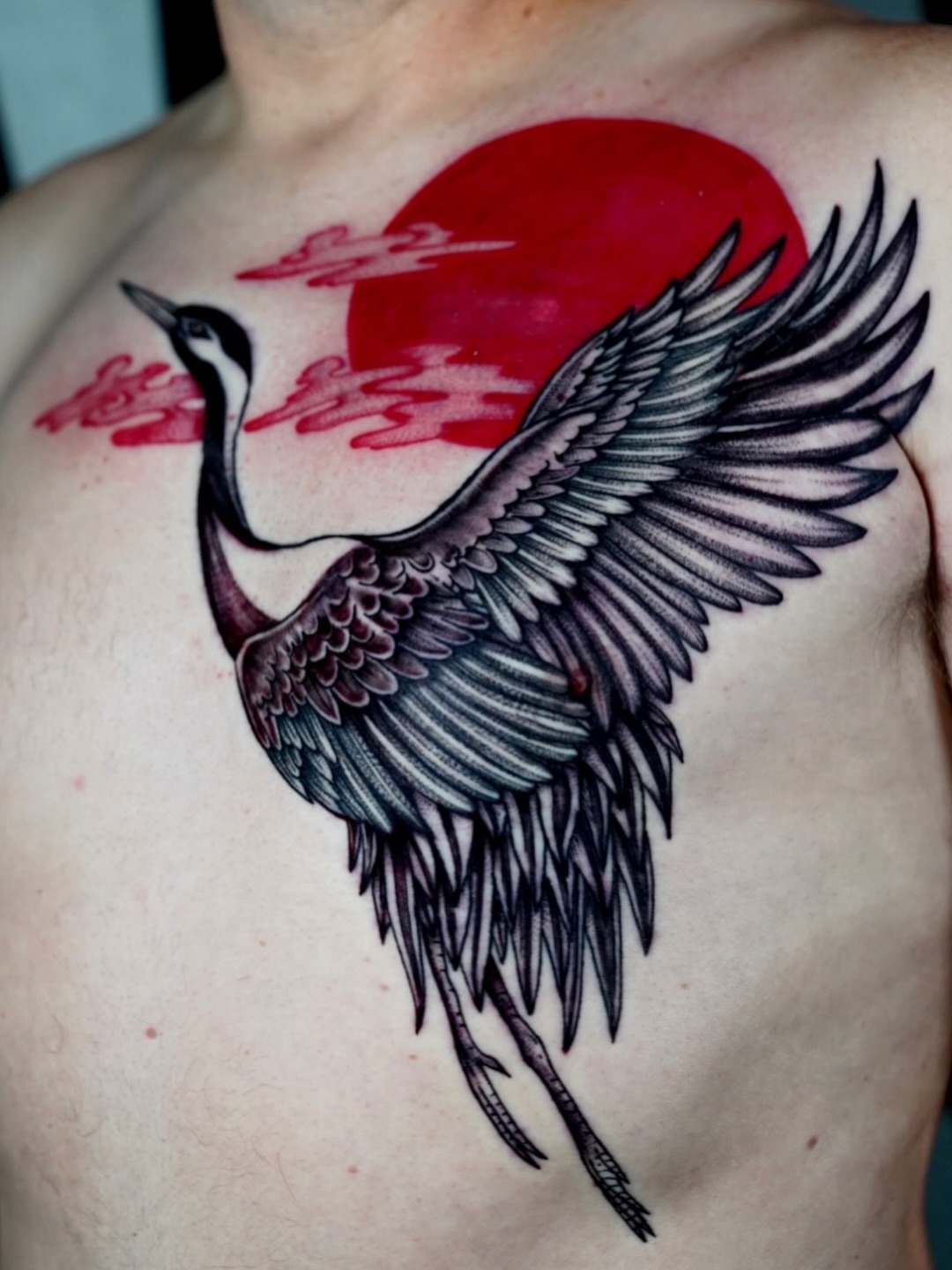 Crane and sun japanese irezumi tattoo on the chest by Kirsten Cameron