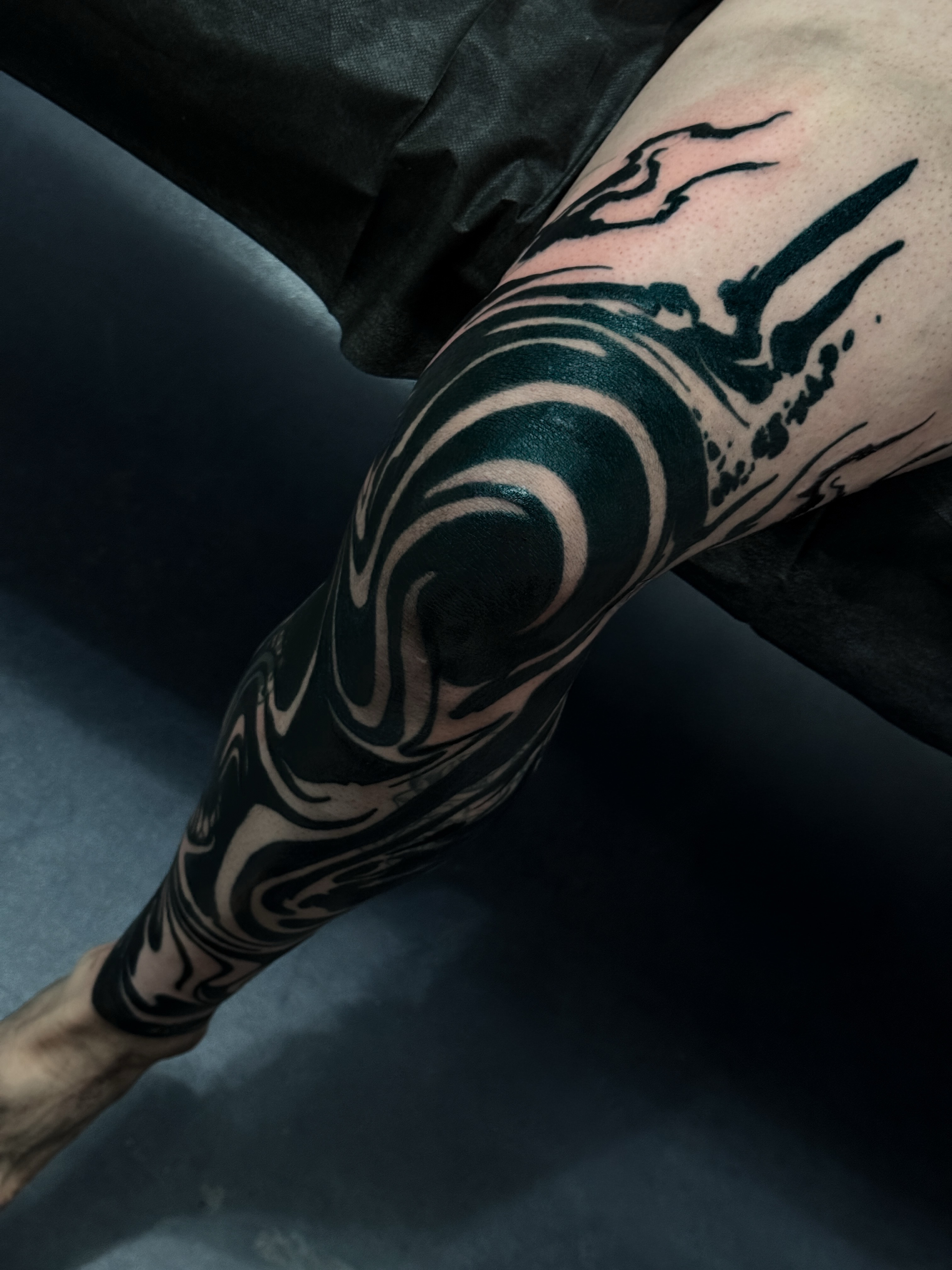 Wave black and grey tattoo on the forearm by Josaline Green