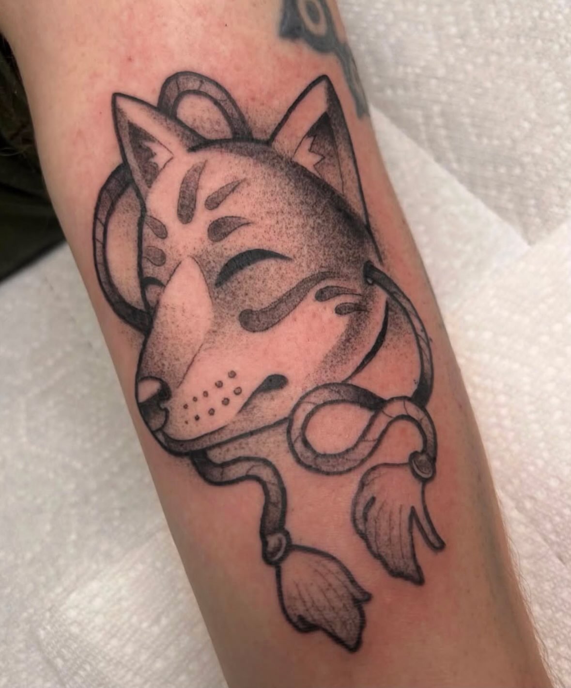 Cat and snake dotwork tattoo on the forearm by Hannah Jean
