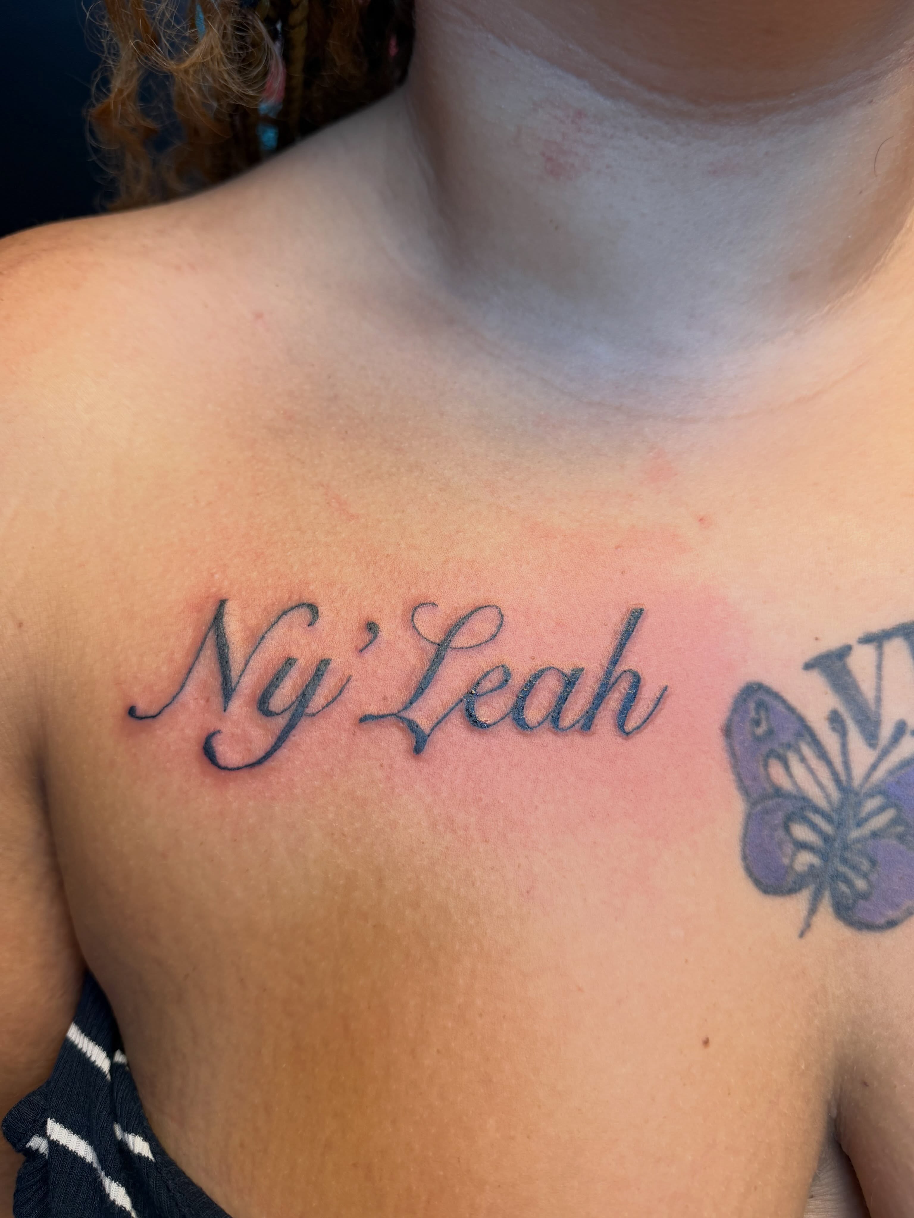 Ny'Leah lettering script tattoo on the chest by XoXandrea.Ink, Kansas City, Missouri