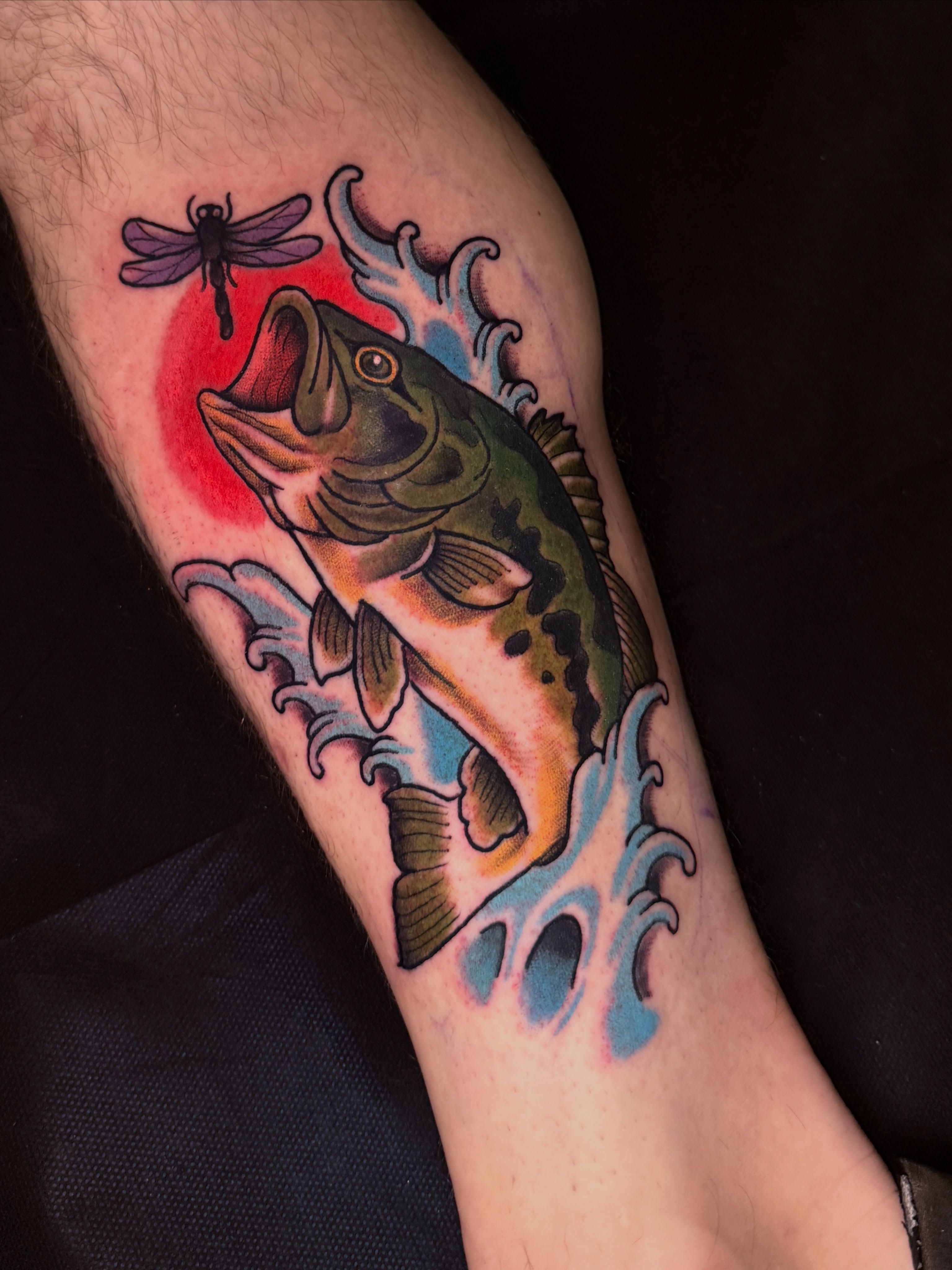 Leaping bass American traditional tattoo on the forearm by Stephen Shaw