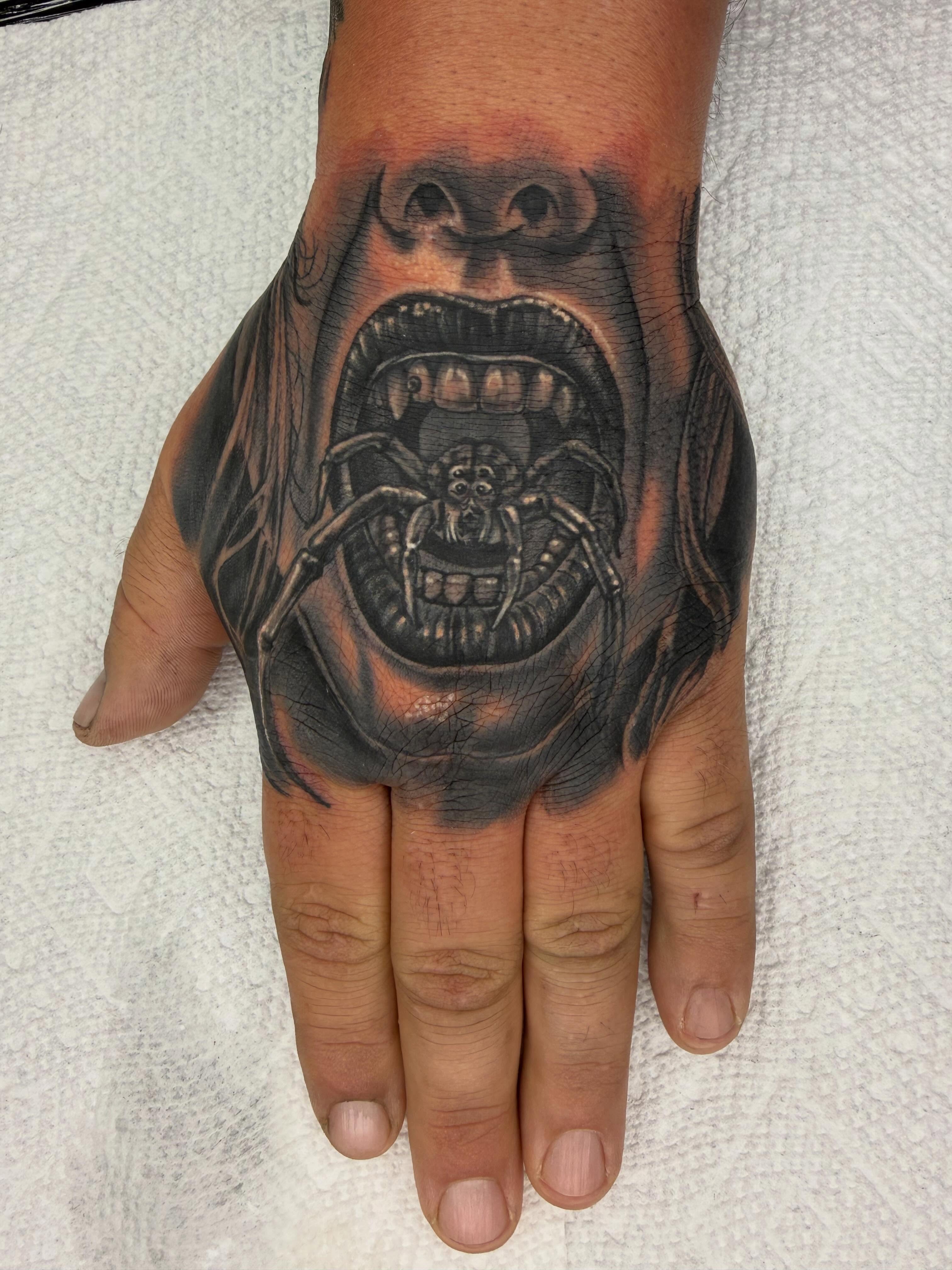 Scream realism tattoo on the hand by Frank DeMao