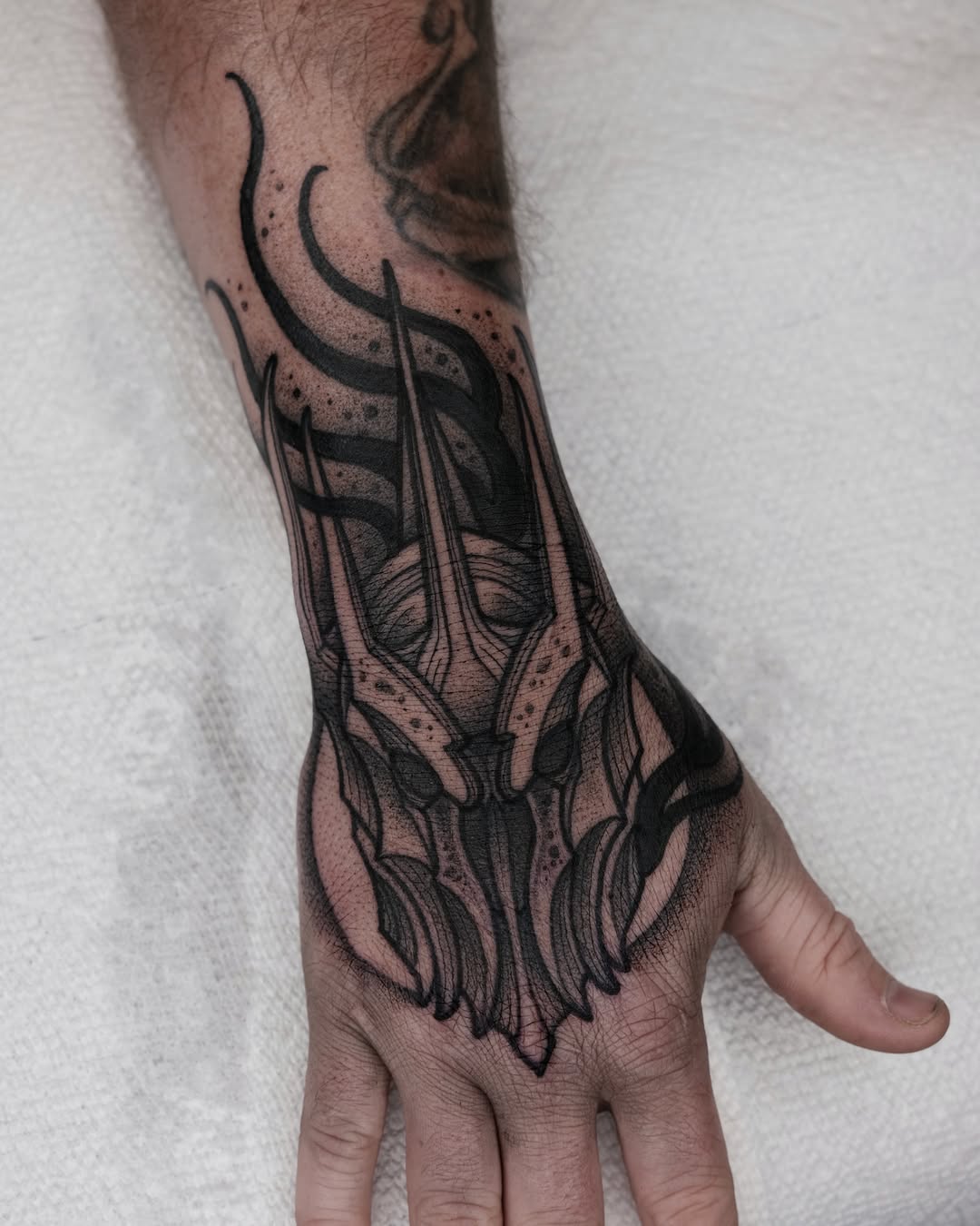 Skull dotwork tattoo on the hand by Kyle Patrick