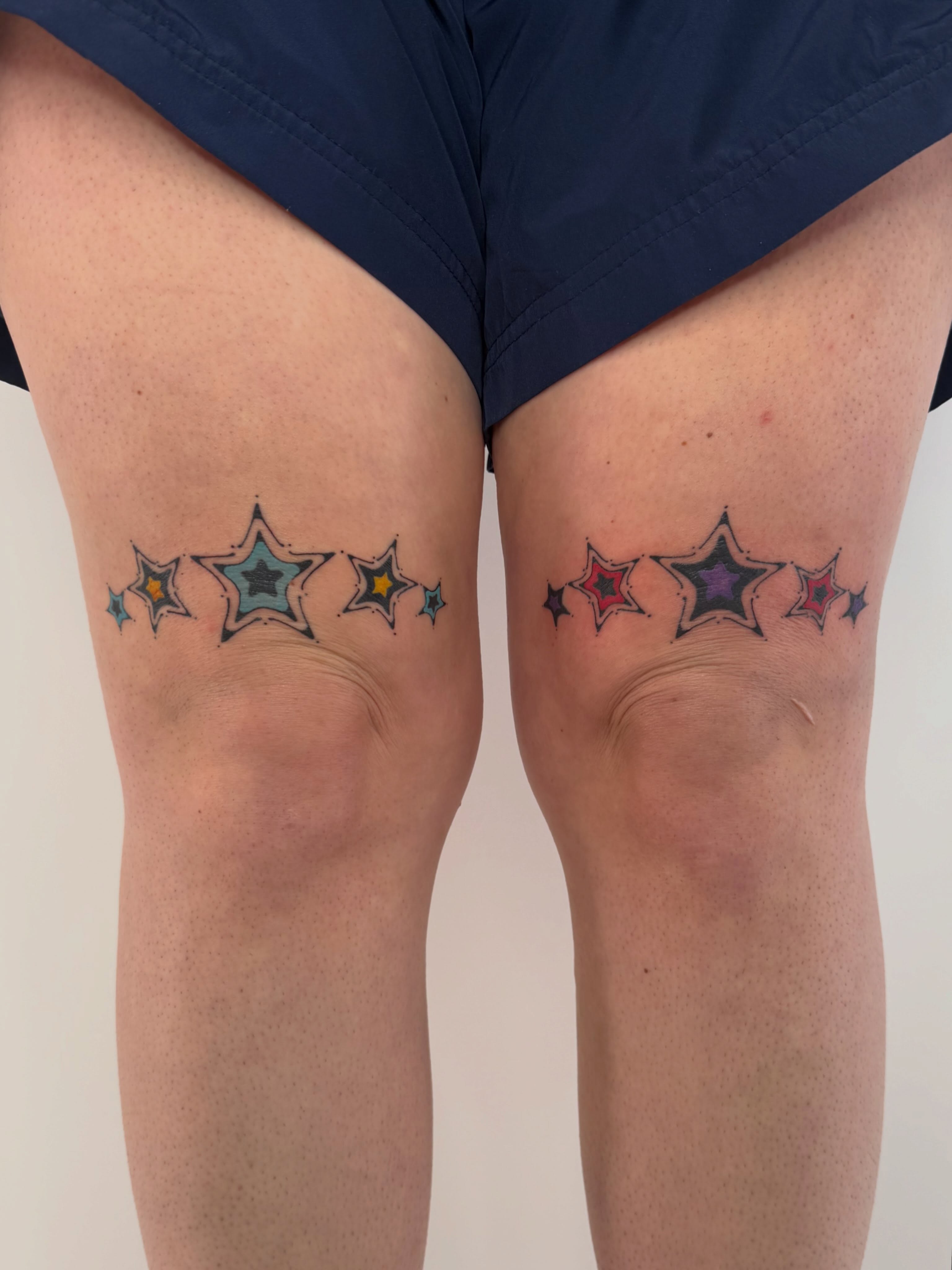 Stars geometric tattoo on the thigh by Leah Ramos