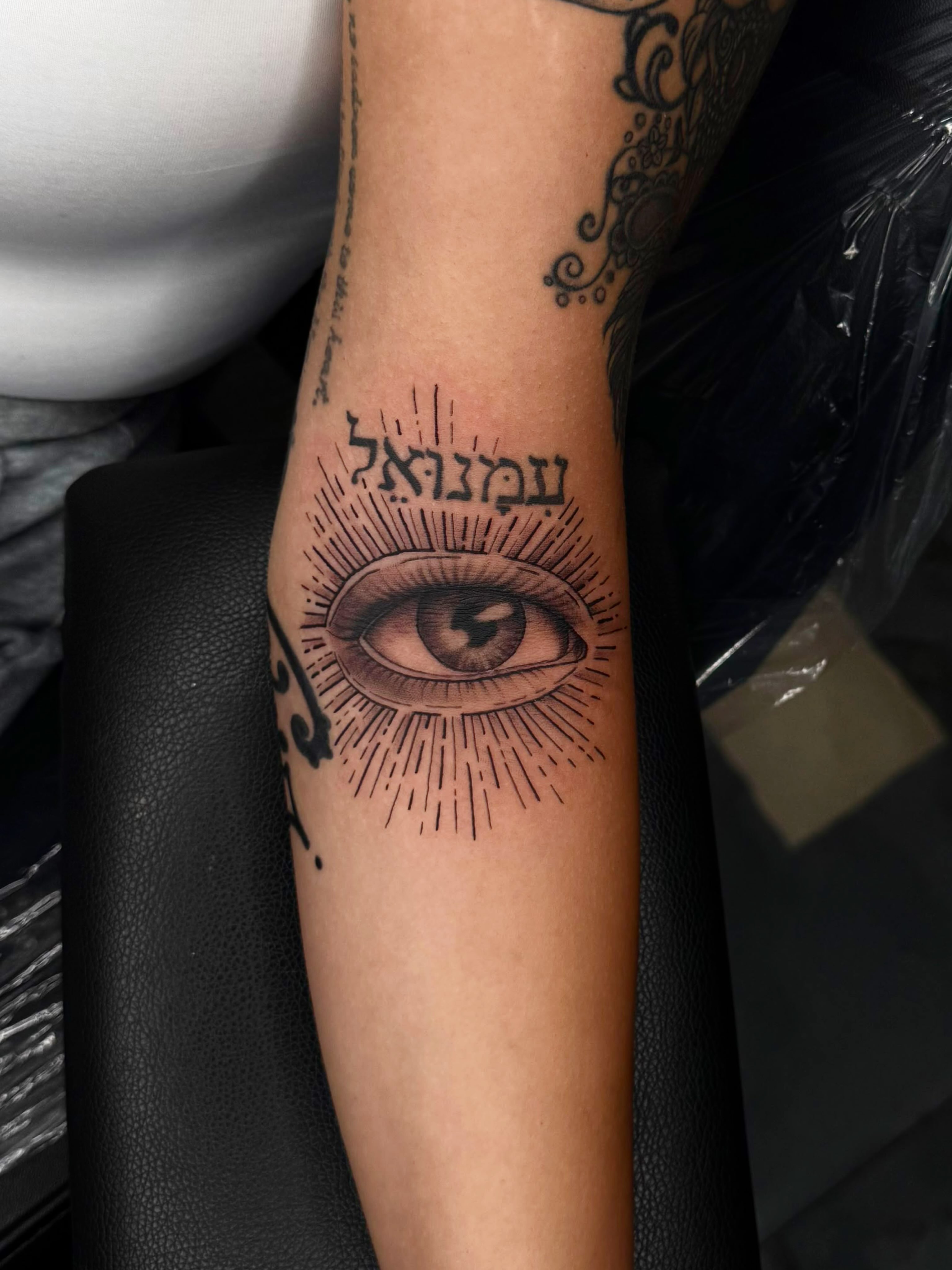 Eye black and grey tattoo on the forearm by Exis LHinc, Miami, Florida