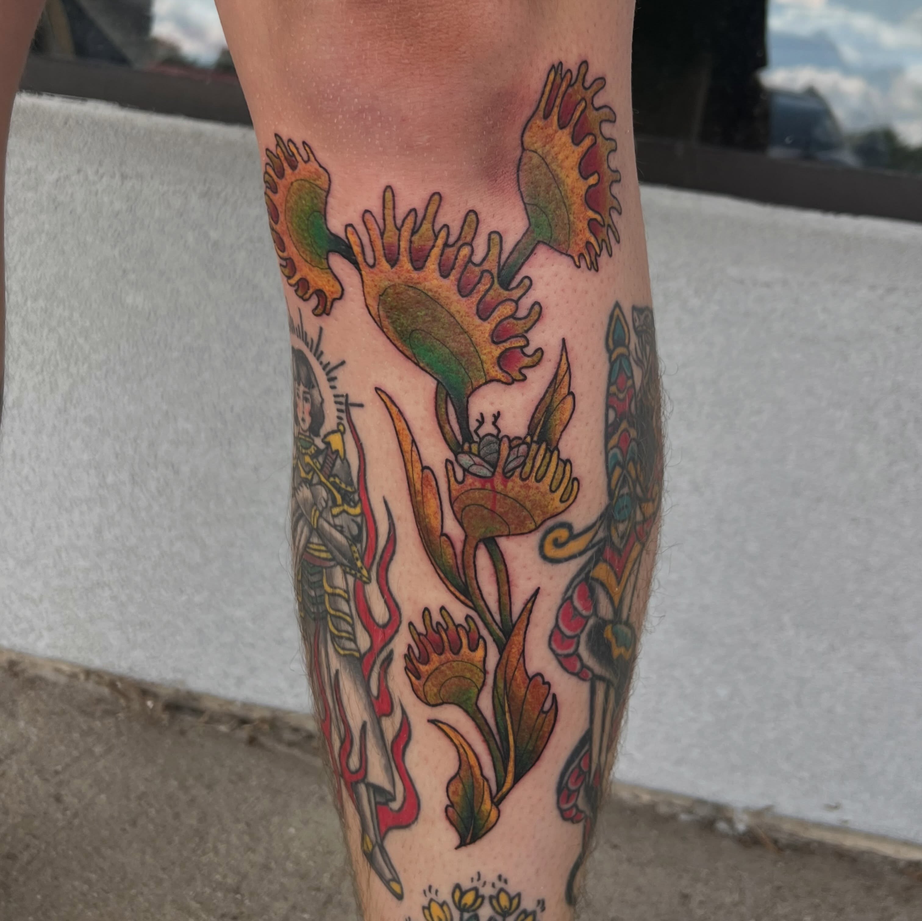 Floral and religious figure American traditional tattoo on the calf by Callie πͺ