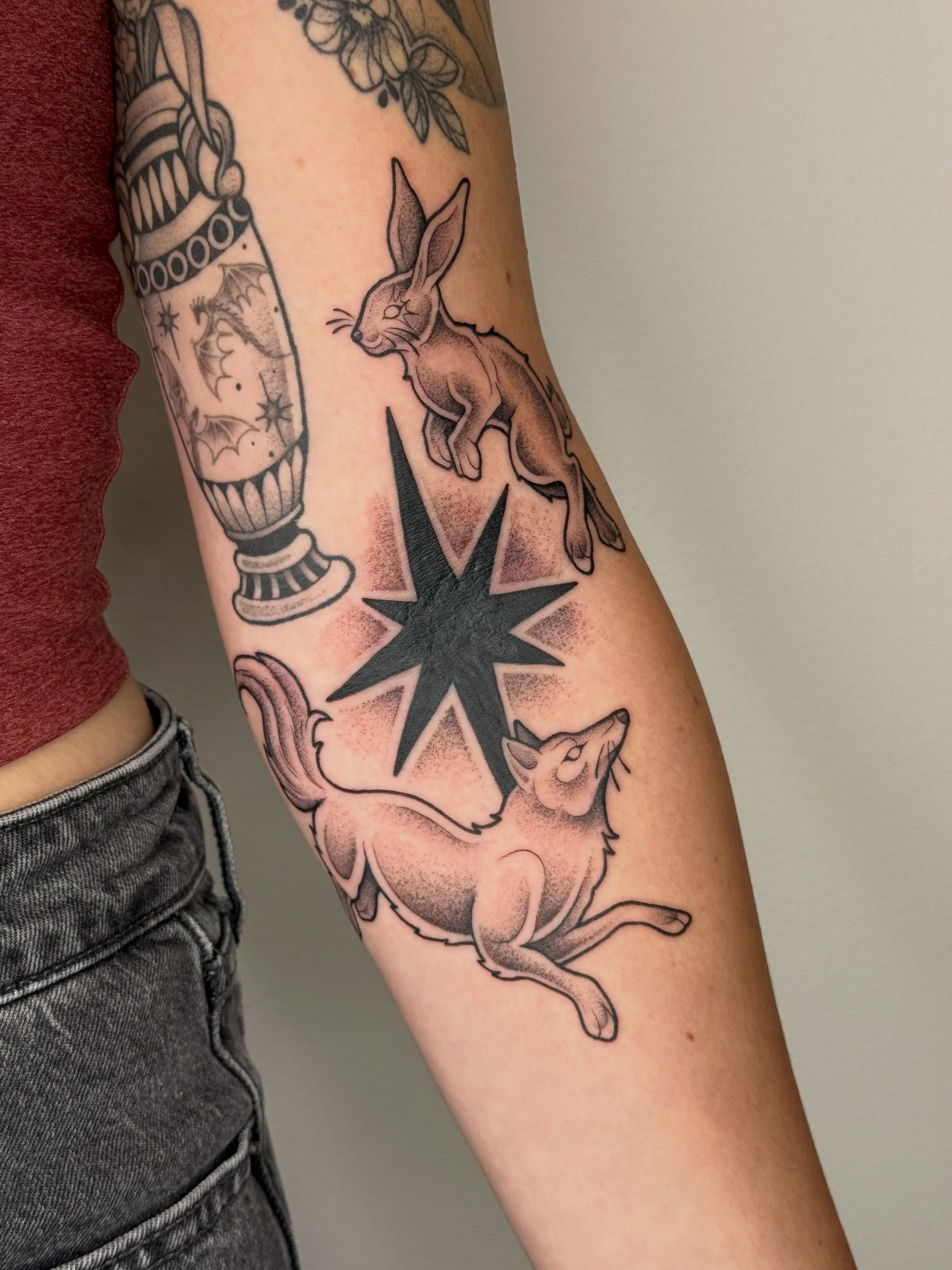 Rabbit and fox American traditional tattoo on the forearm by Emma Friesen - Lancaster & York Tattoo Artist, Lancaster, Pennsylvania