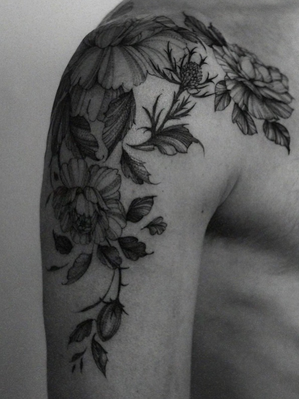 Floral arrangement realism tattoo on the shoulder by Temple Adorned Tattoo