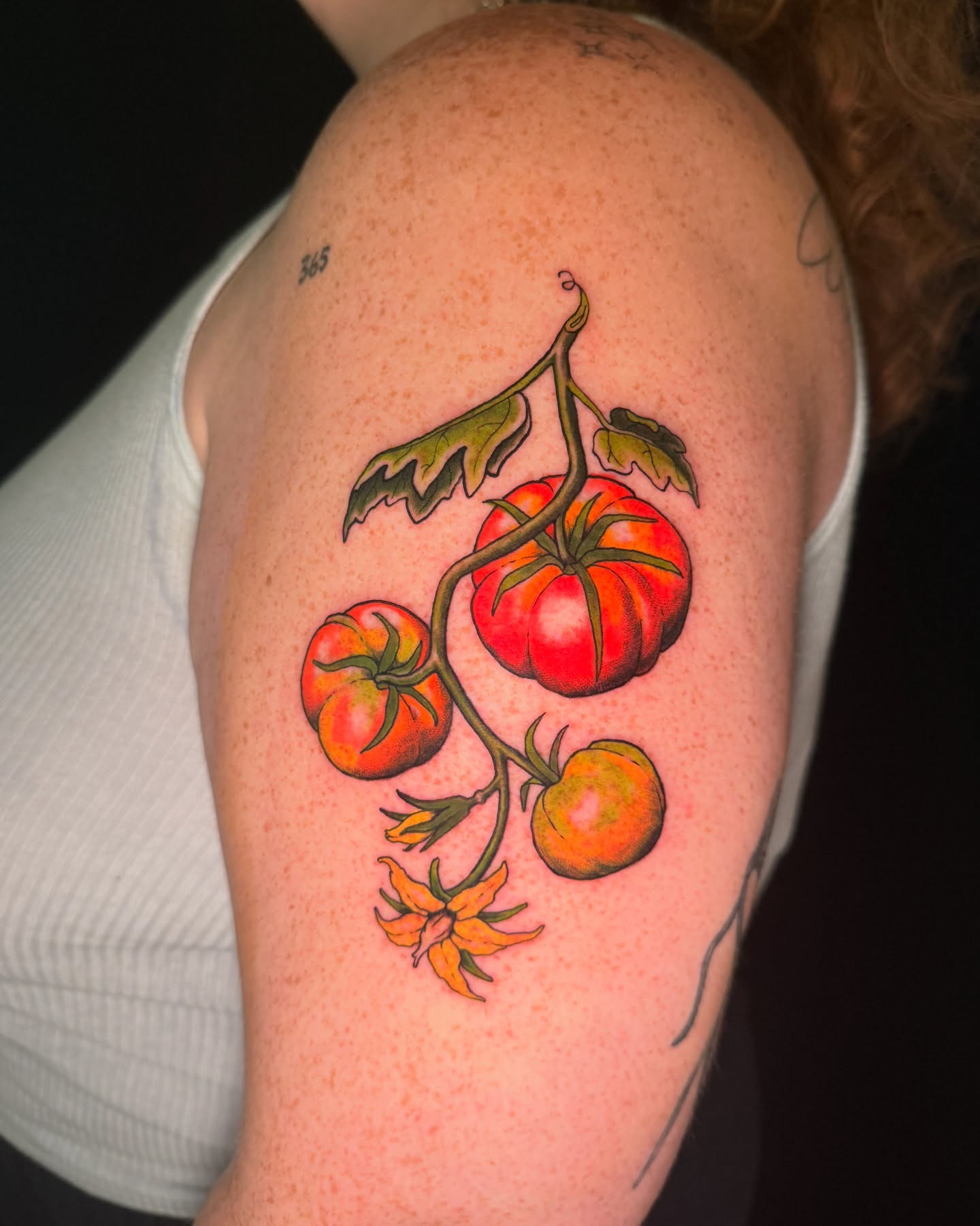Tomatoes realism tattoo on the shoulder by marlena borscheid