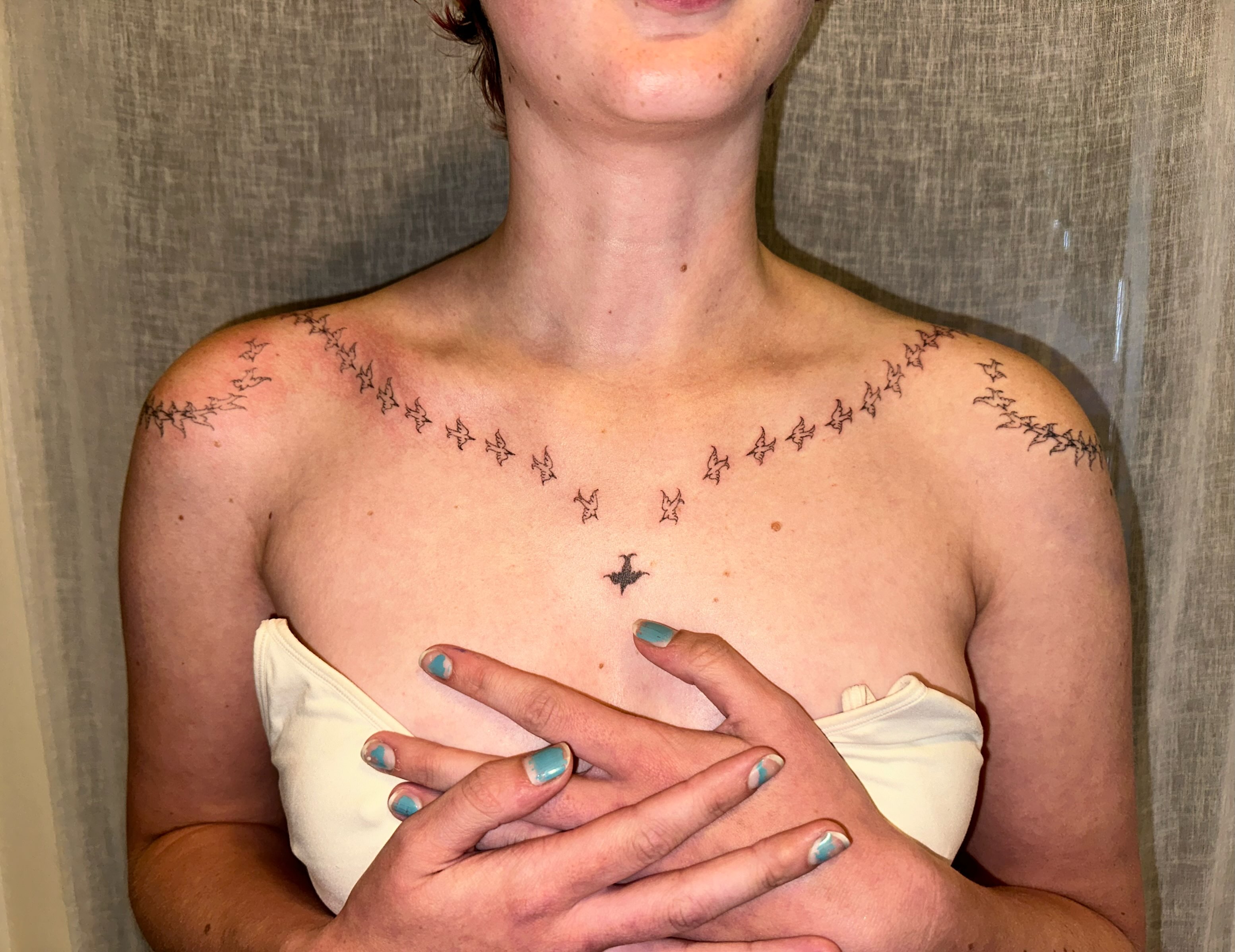 Bird geometric tattoo on the chest by kate