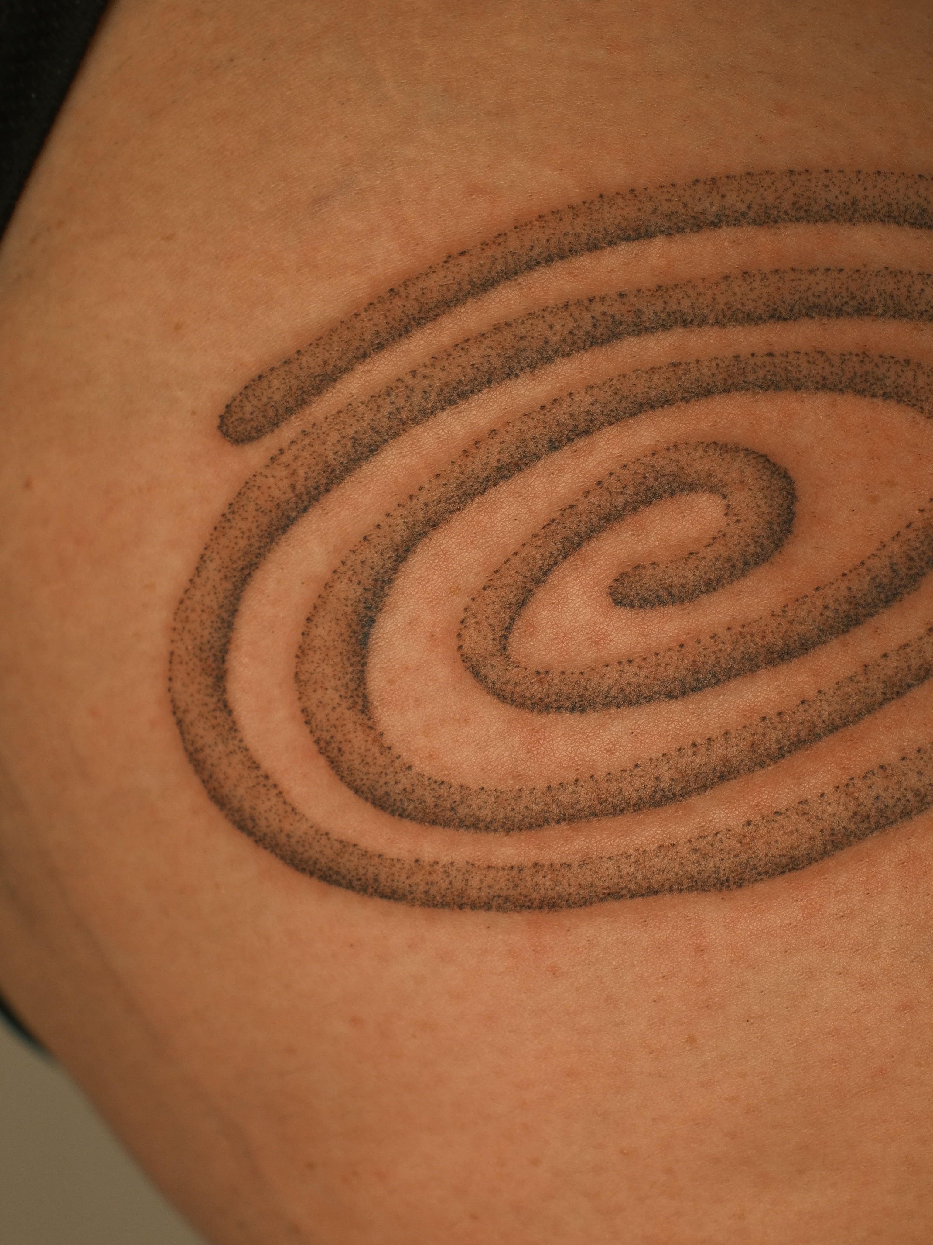 Spiral dotwork tattoo on the thigh by Diana ๐ซ