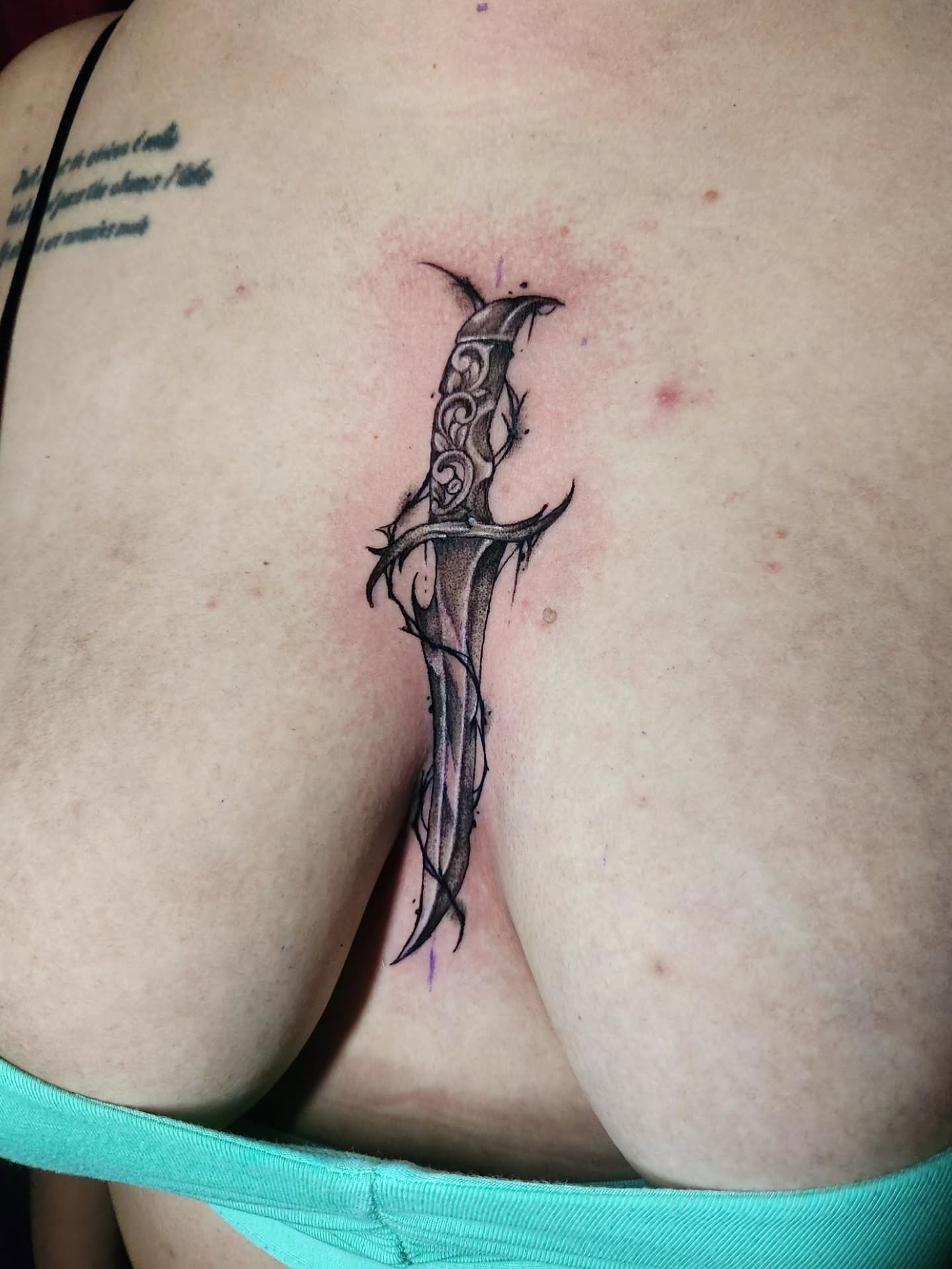 Sword black and grey tattoo on the back by Abby Renteria