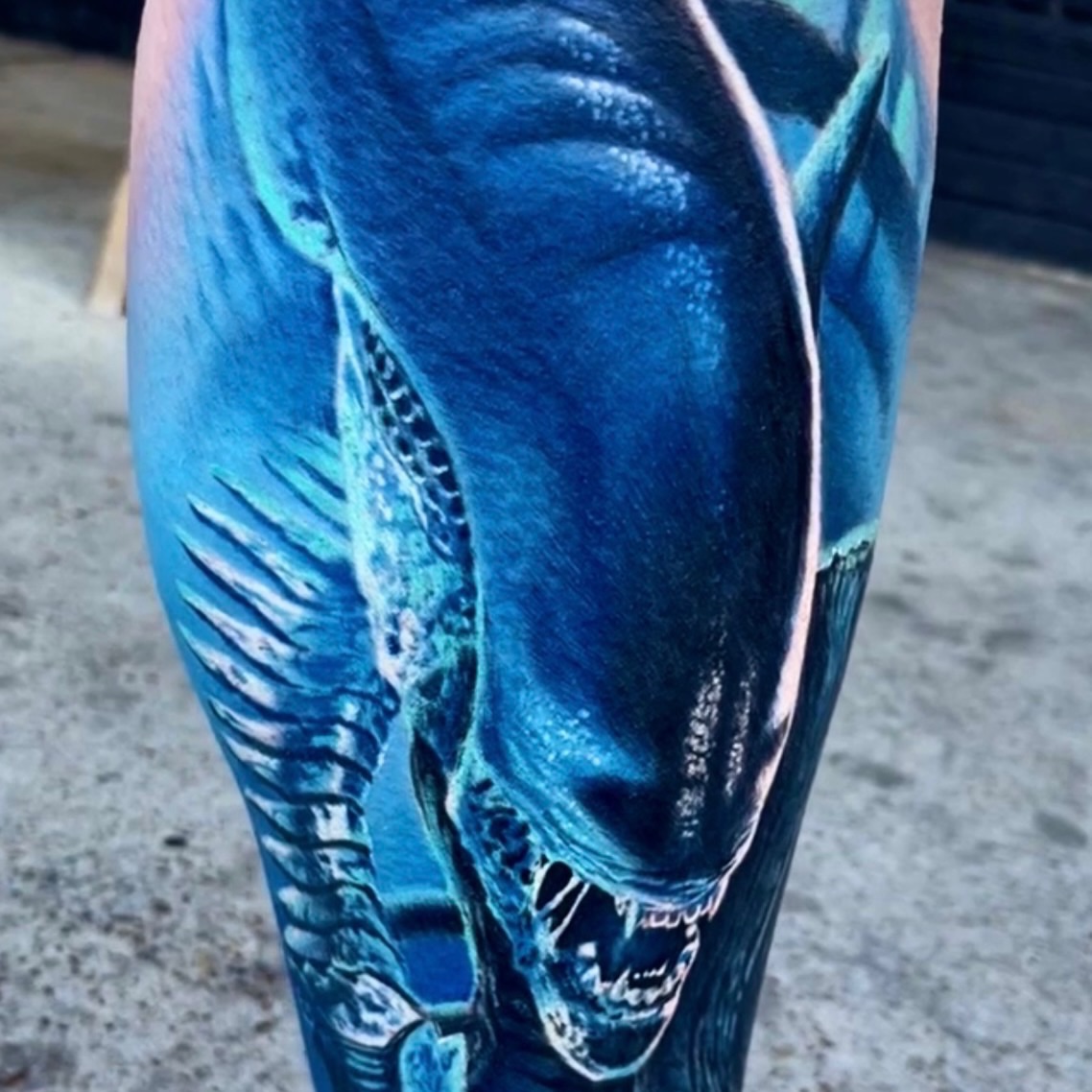 Alien head realism tattoo on the calf by Zack Havoc