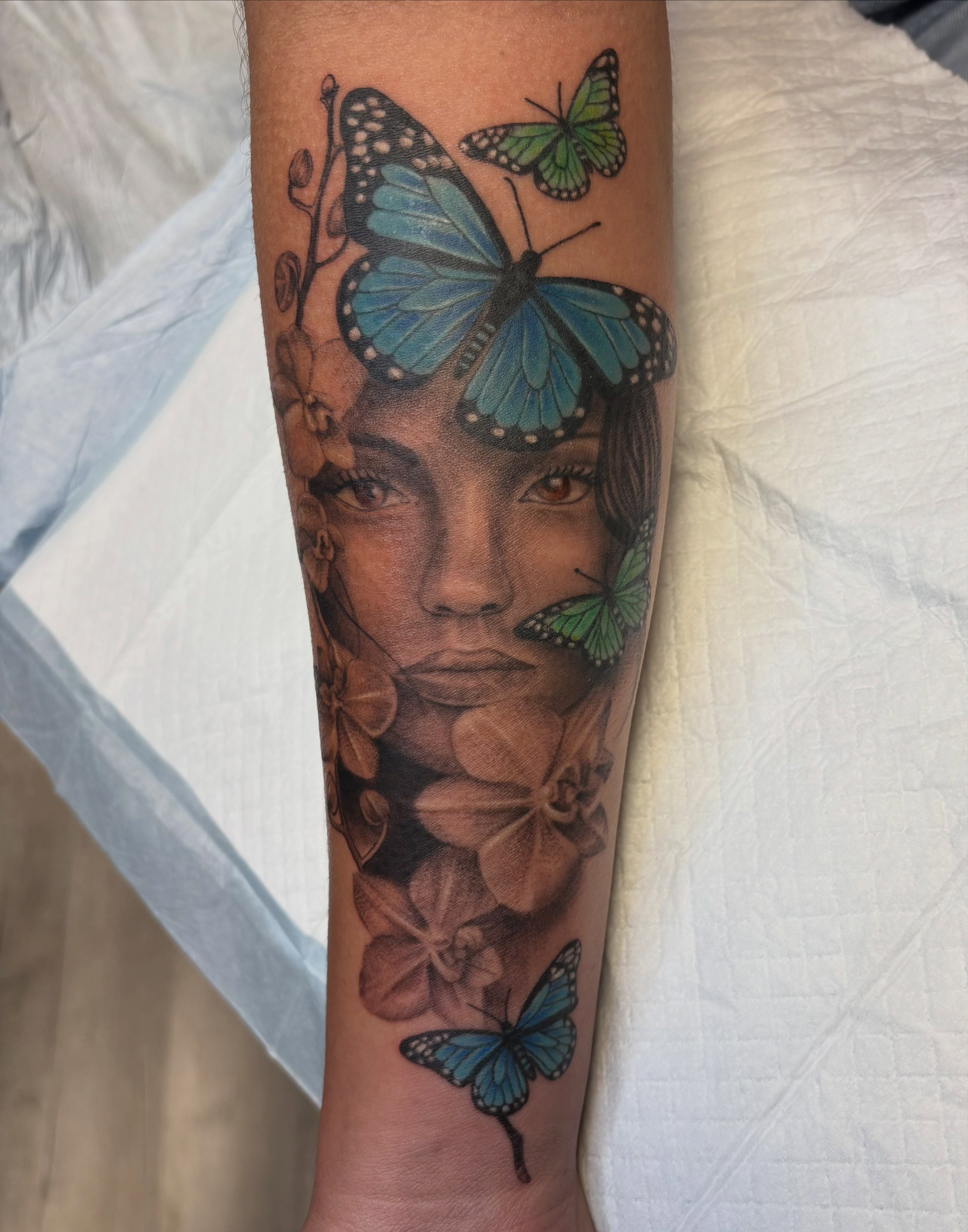 Woman with butterflies realism tattoo on the forearm by ~KR¥$~