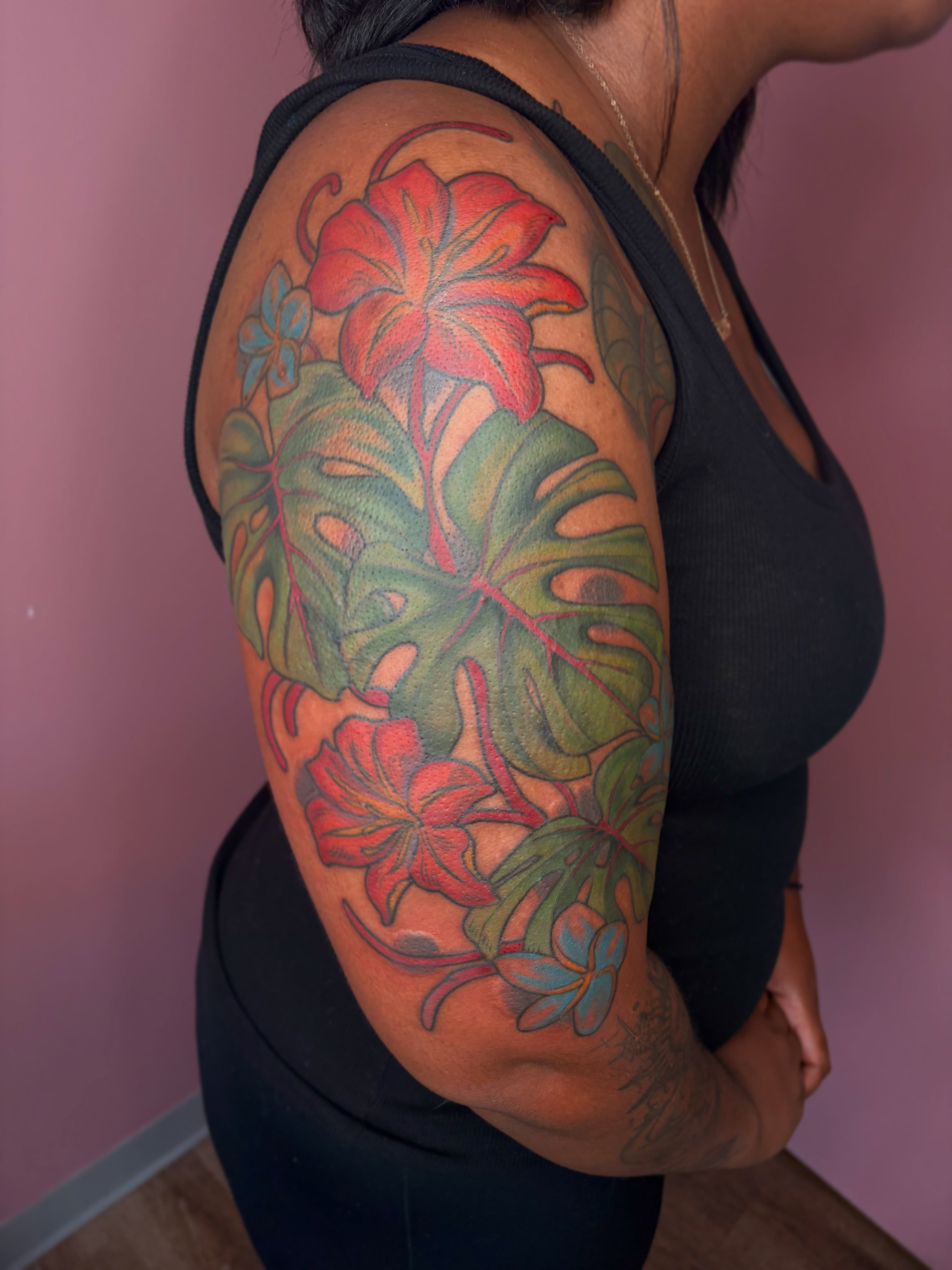 Floral arrangement realism tattoo on the upper arm by Allyson Blessing Tattoos