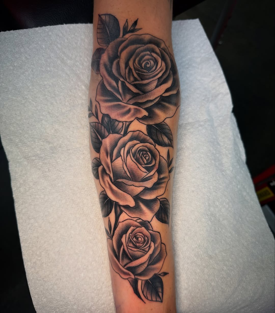 Roses black and grey tattoo on the forearm by Jake Horstman, Dayton, Ohio