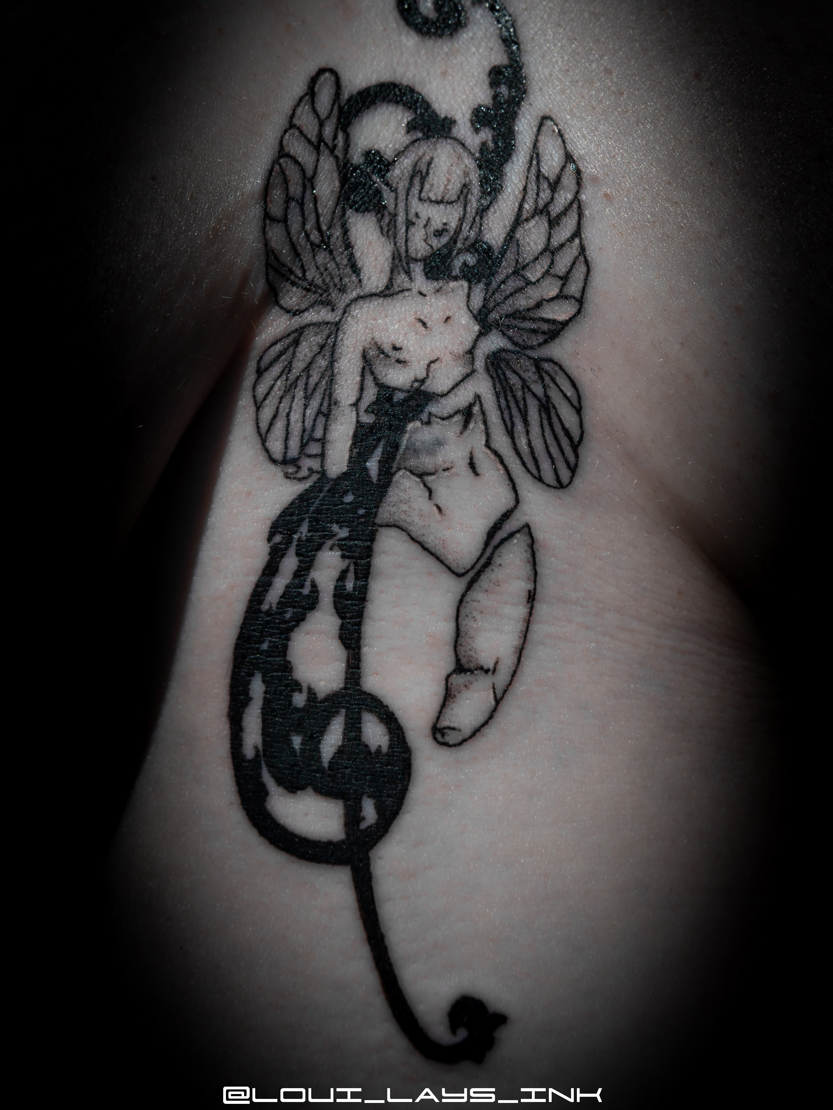 Tattoo by @loui_lays_ink — black_and_grey, dark_realism