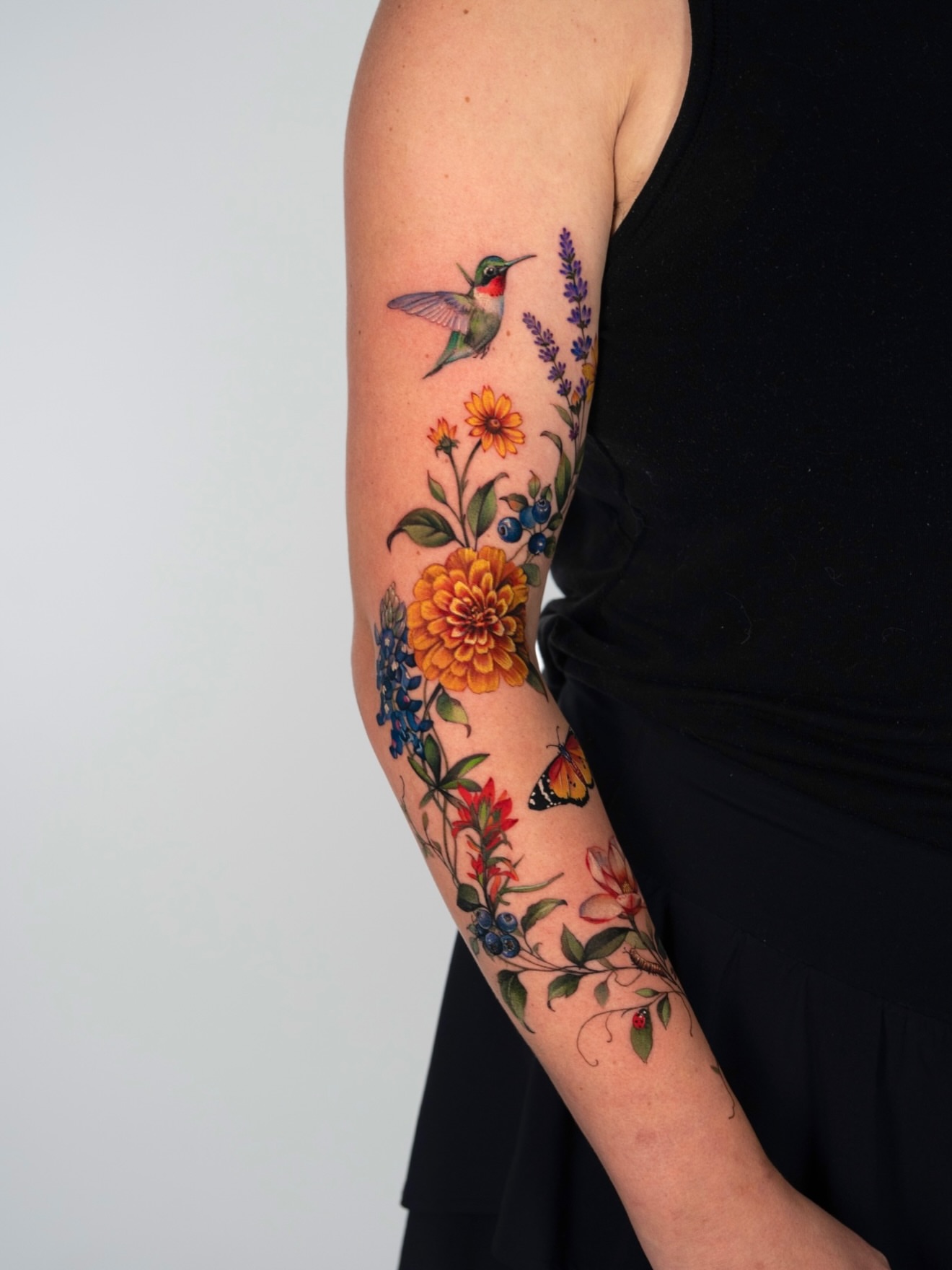 Floral bouquet realism tattoo on the forearm by 𝐍𝐈𝐂𝐎𝐋𝐄 𝐋