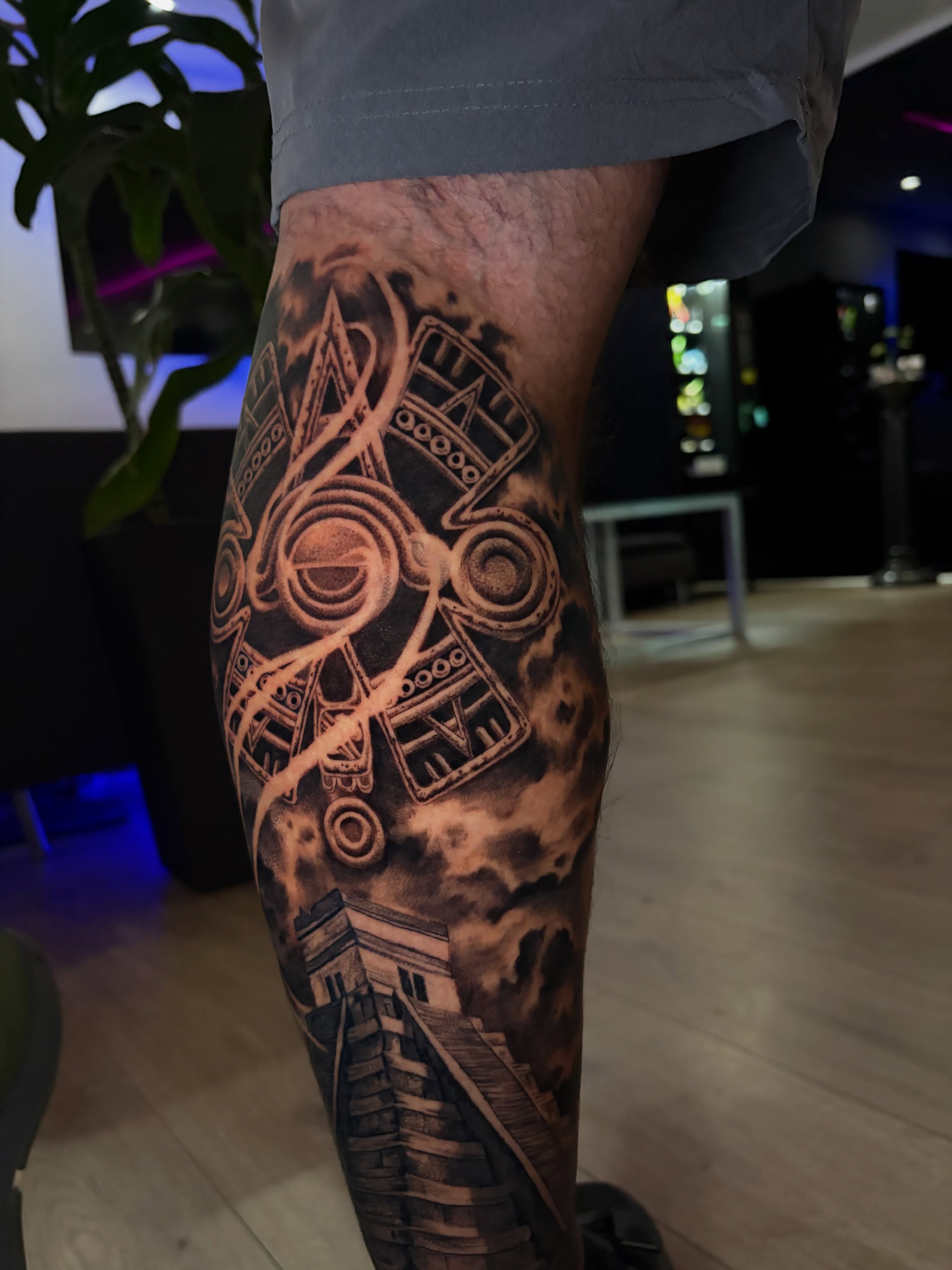 Mechanical structure with musical notes geometric tattoo on the forearm by Luis VP