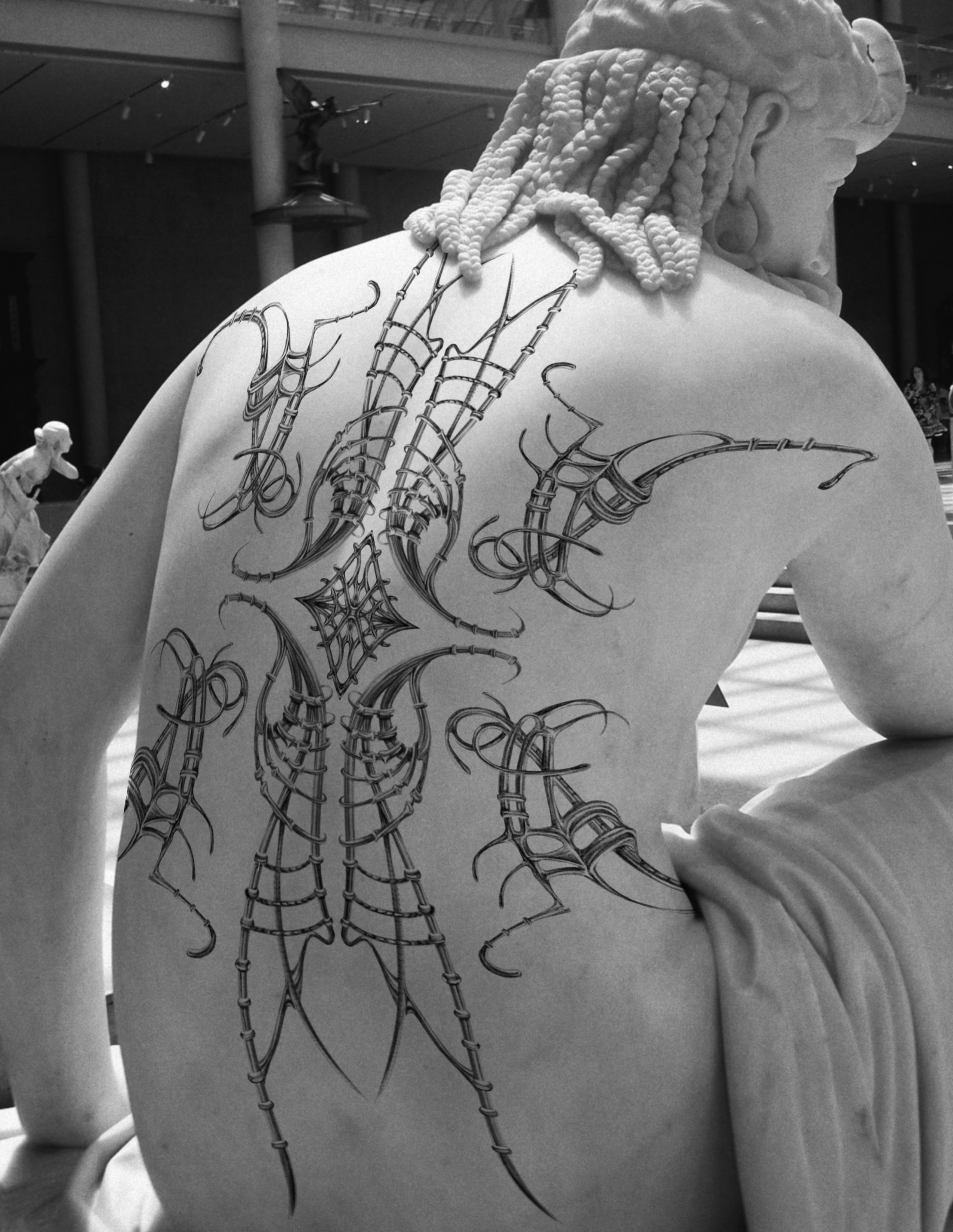 Spiderweb geometric tattoo on the back by Lauren ๐