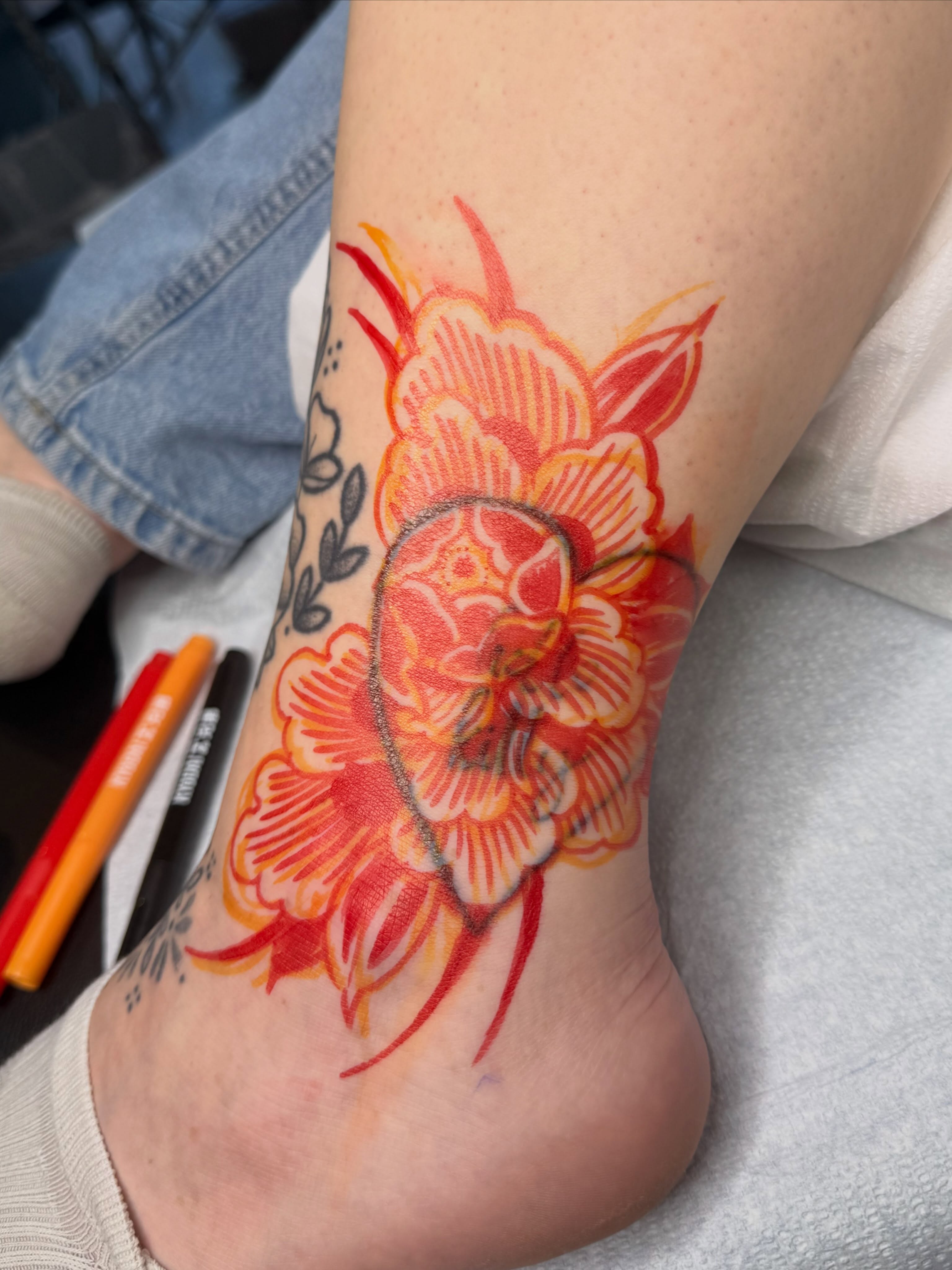 Floral design watercolor tattoo on the foot by Sarah Christine Tattoo, Calgary, Alberta