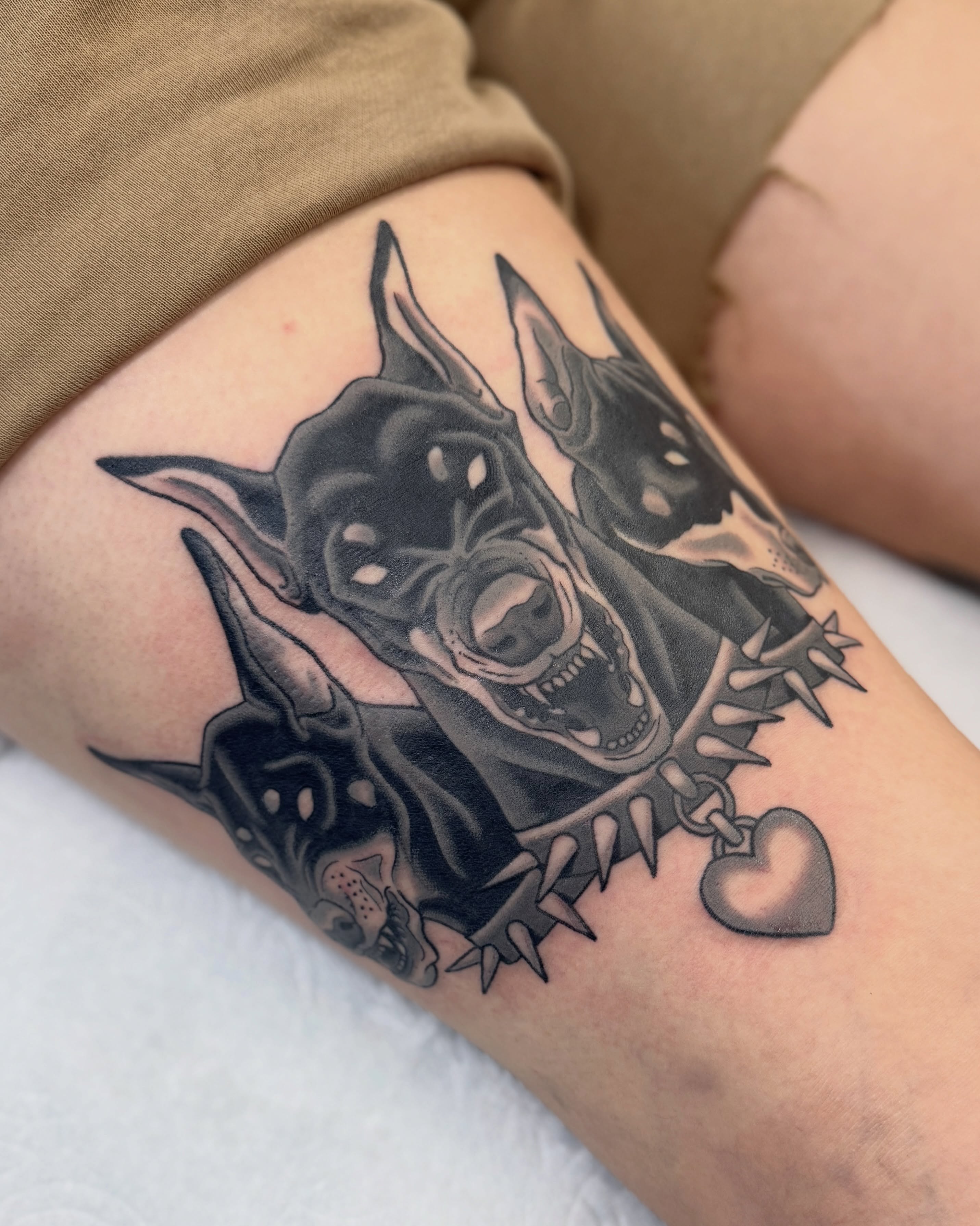 Doberman black and grey tattoo on the forearm by Nia (Knee-uhh) 🦷
