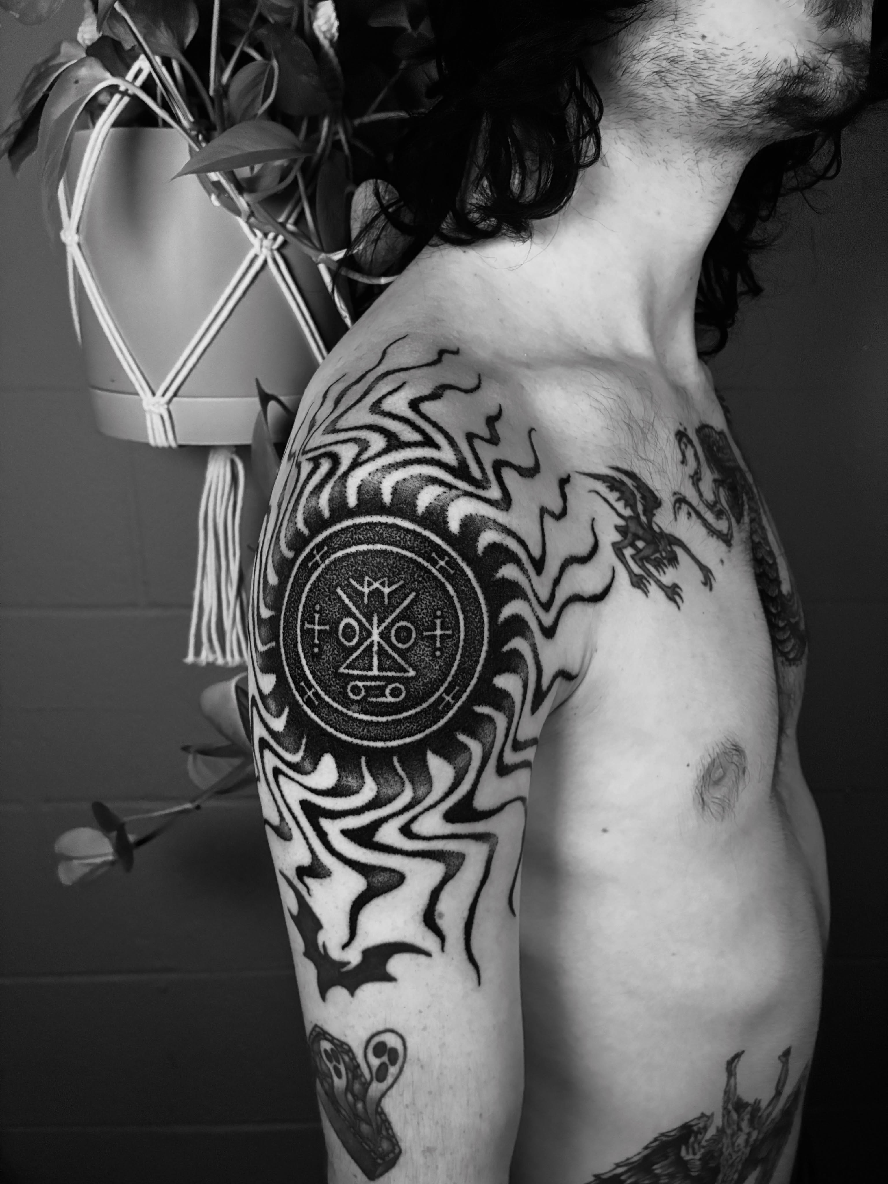 Circle with symbols dotwork tattoo on the shoulder by Zachary R Bobkoff