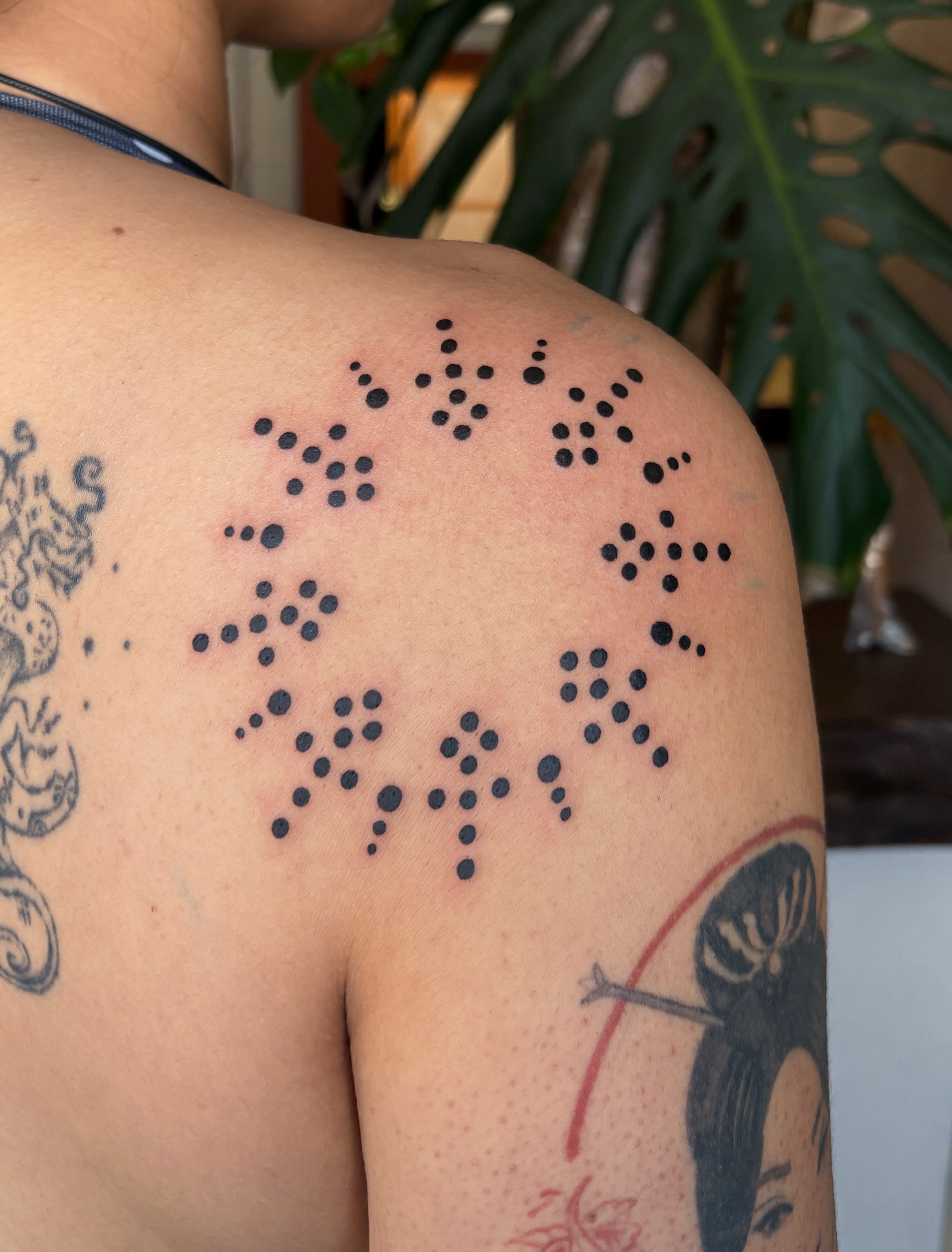 Braille text dotwork tattoo on the shoulder by Abigail, San Francisco, California