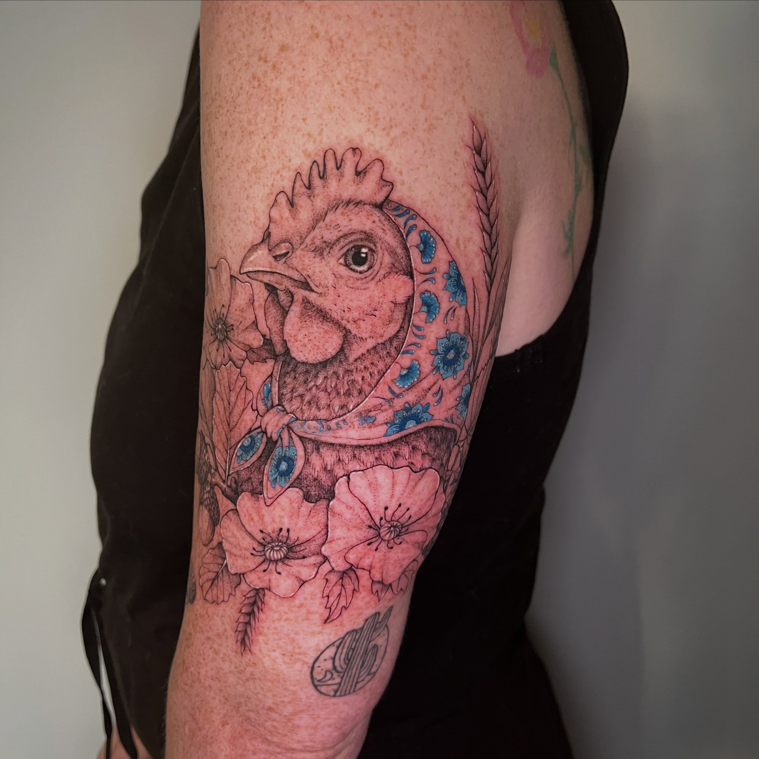 Chicken with floral bandana realism tattoo on the forearm by PenumbRaeTattoo