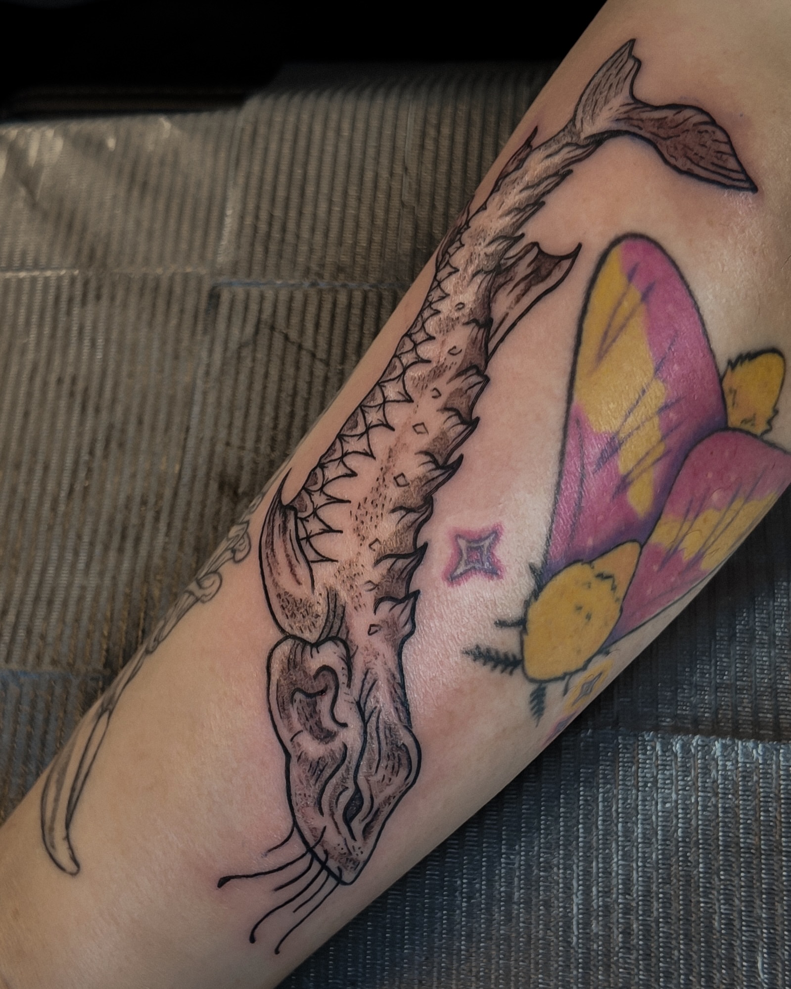 Koi fish and butterfly American traditional tattoo on the forearm by Morgan Diann