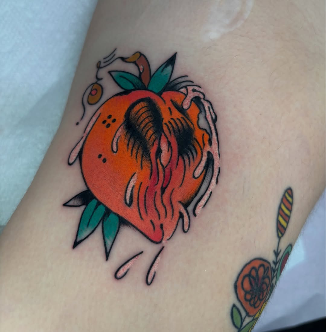Strawberry American traditional tattoo on the forearm by ericka bates