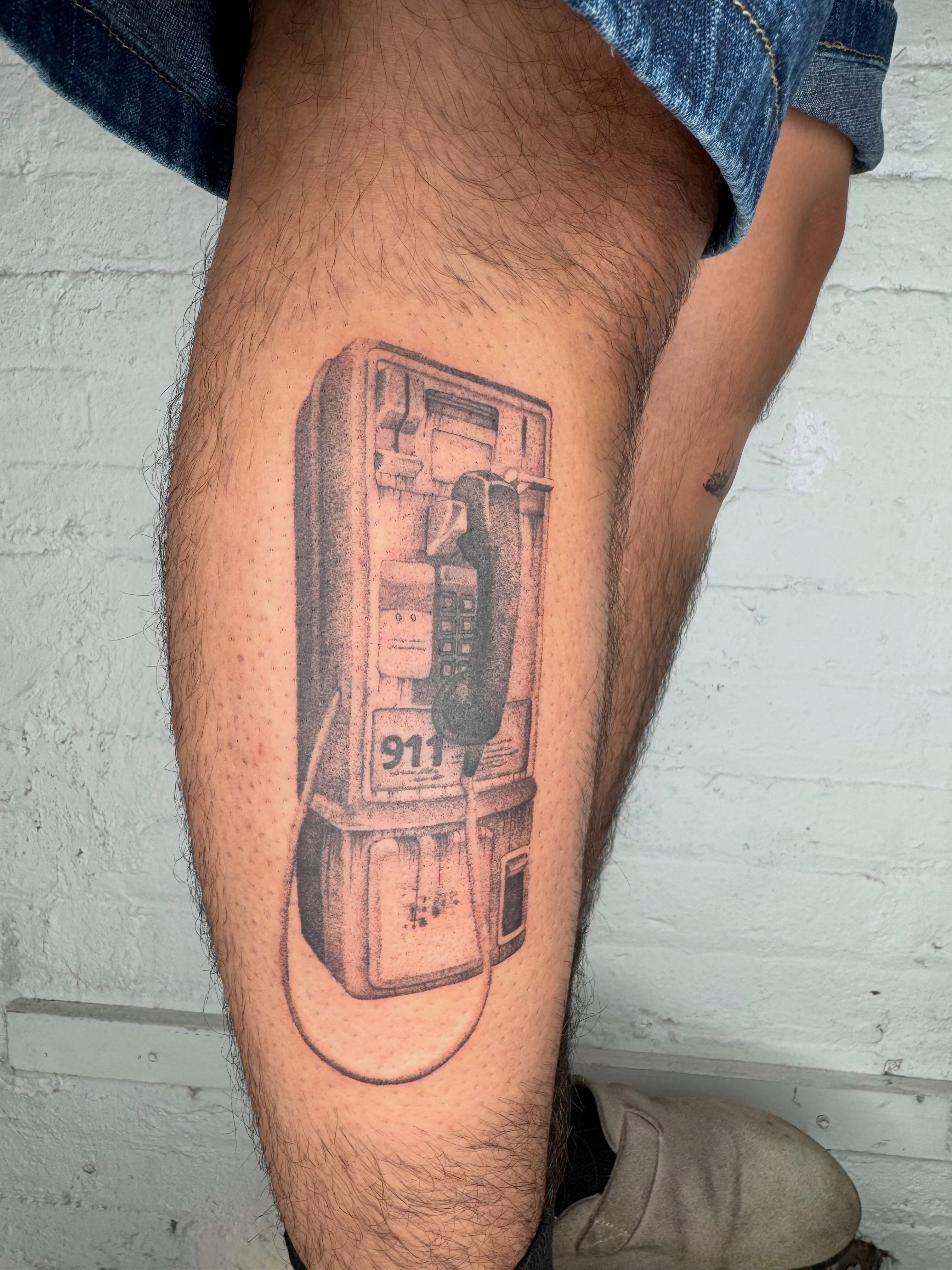 Payphone realism tattoo on the leg by Kenny ๐ด