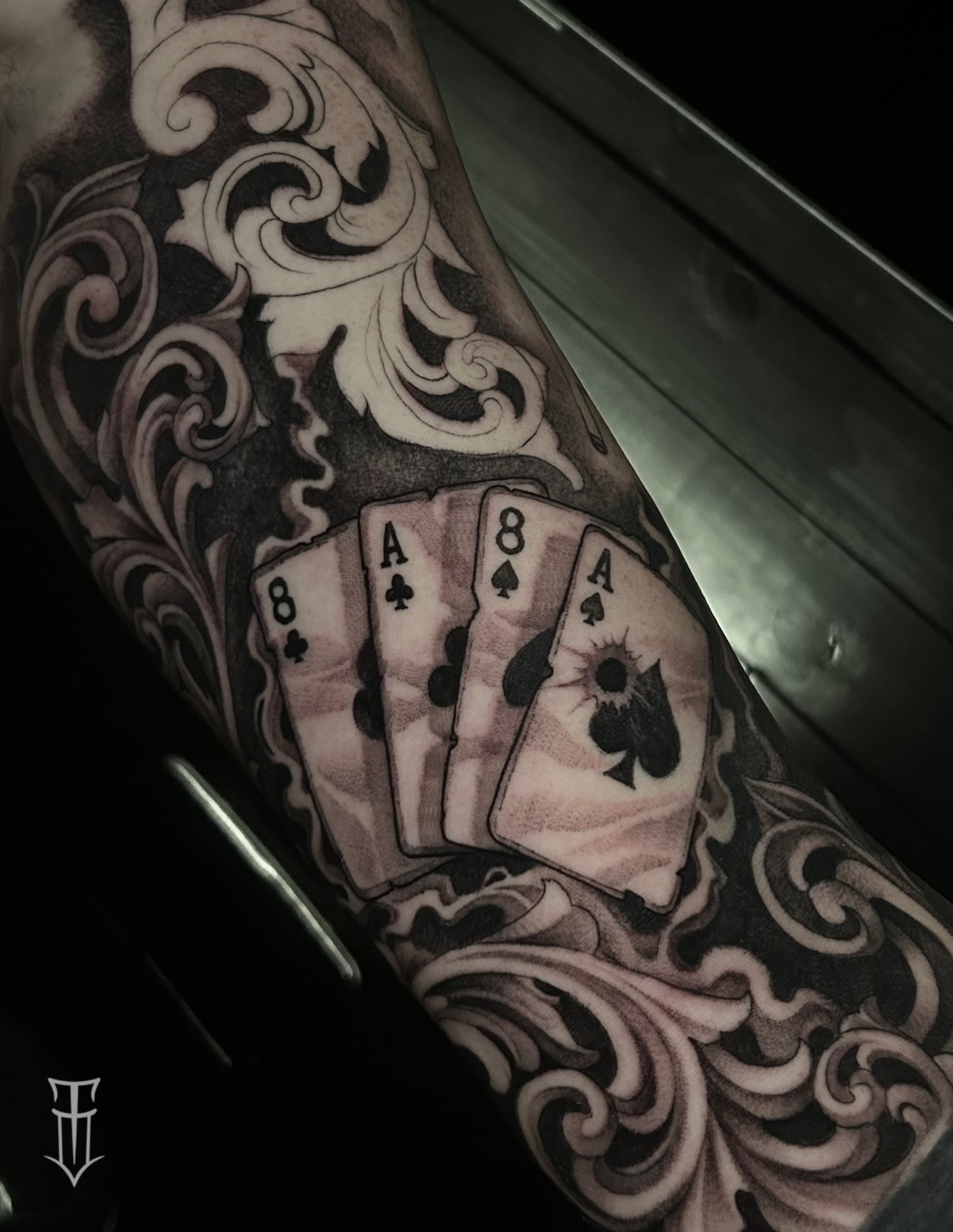 Playing cards American traditional tattoo on the forearm by Tyler Osburn