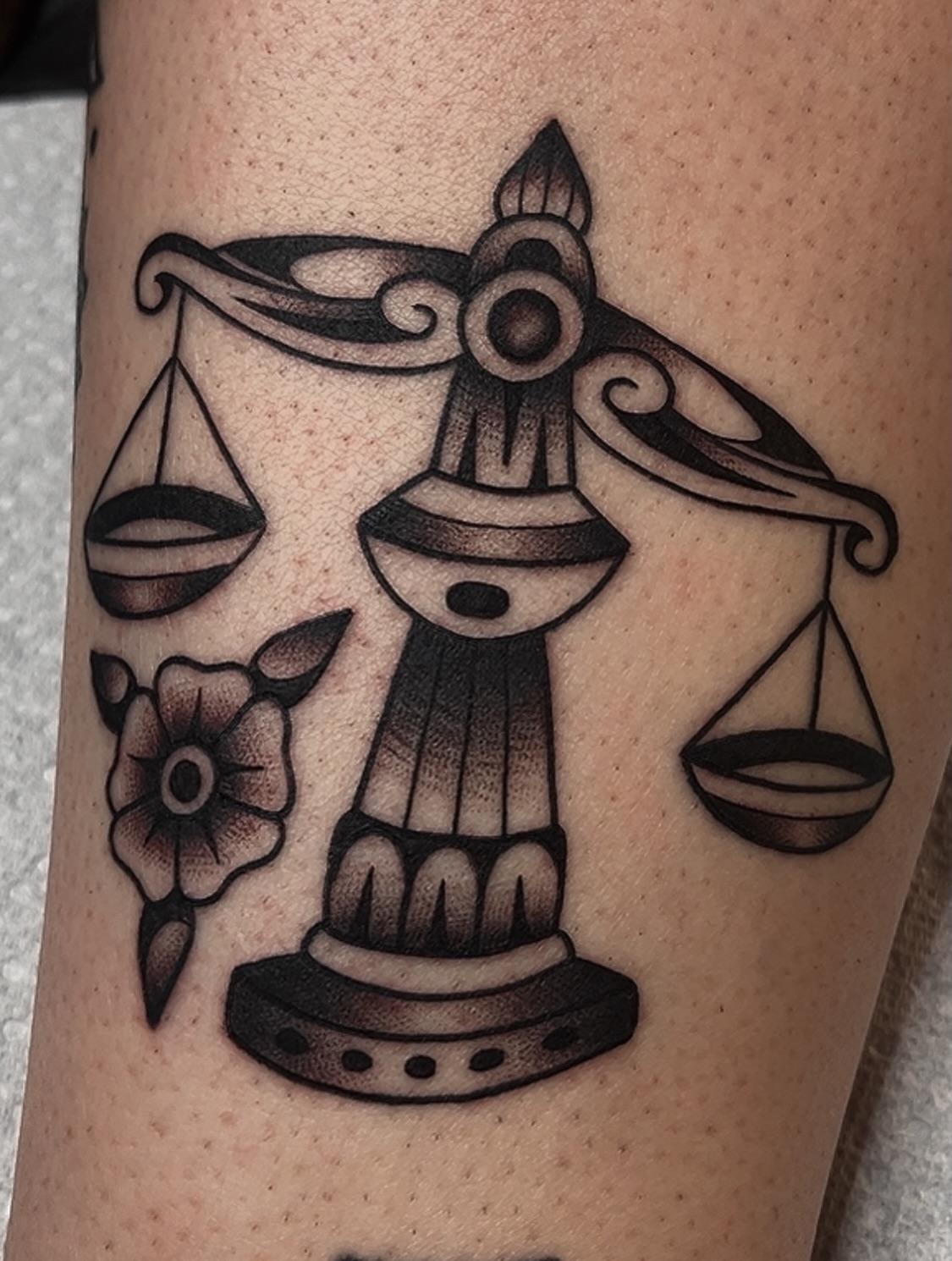 Libra scales black and grey tattoo on the forearm by Las Vegas Tattoo Artist