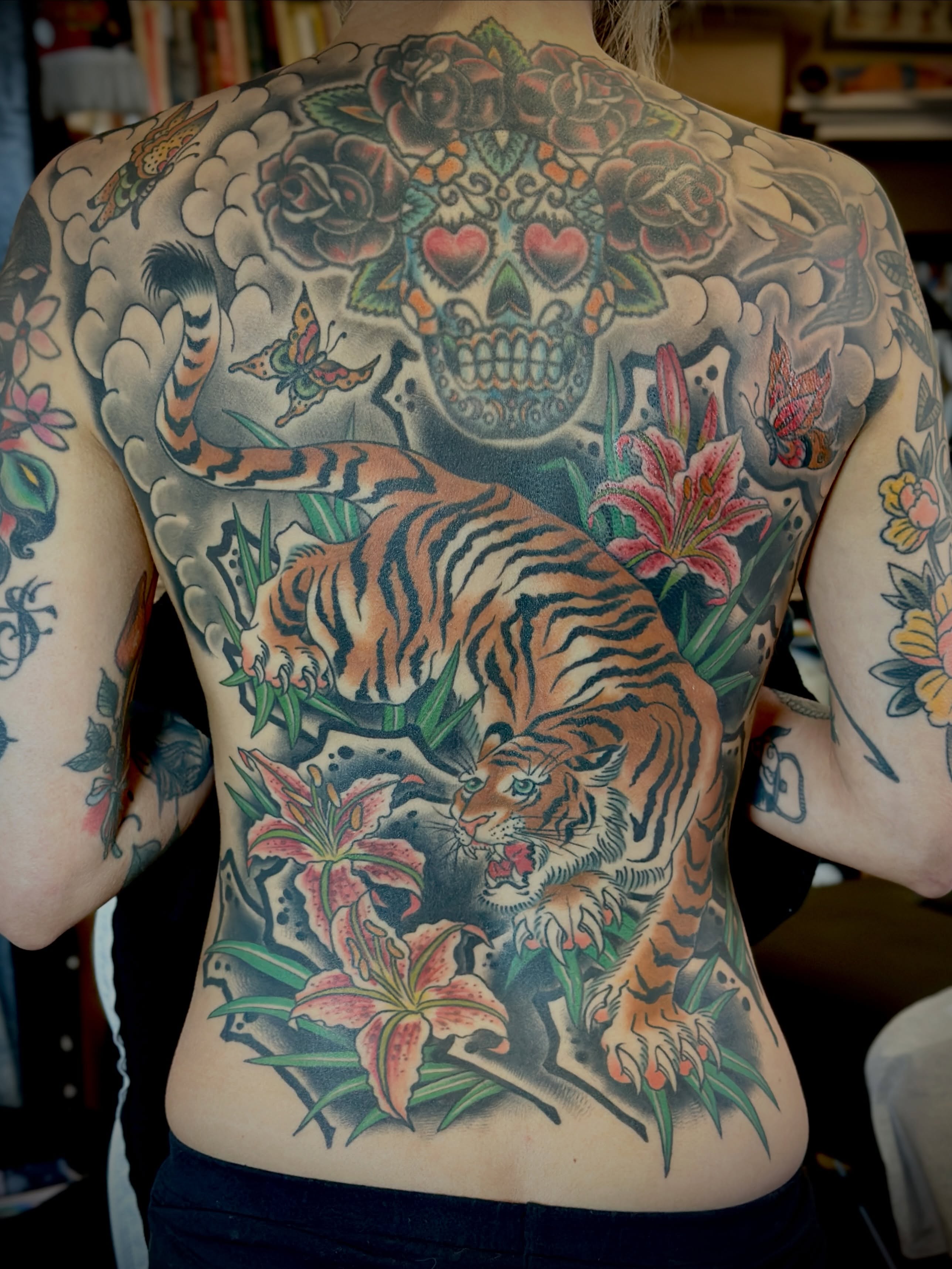 Tiger and sugar skull American traditional tattoo on the back by Holly Ellis, San Francisco, California