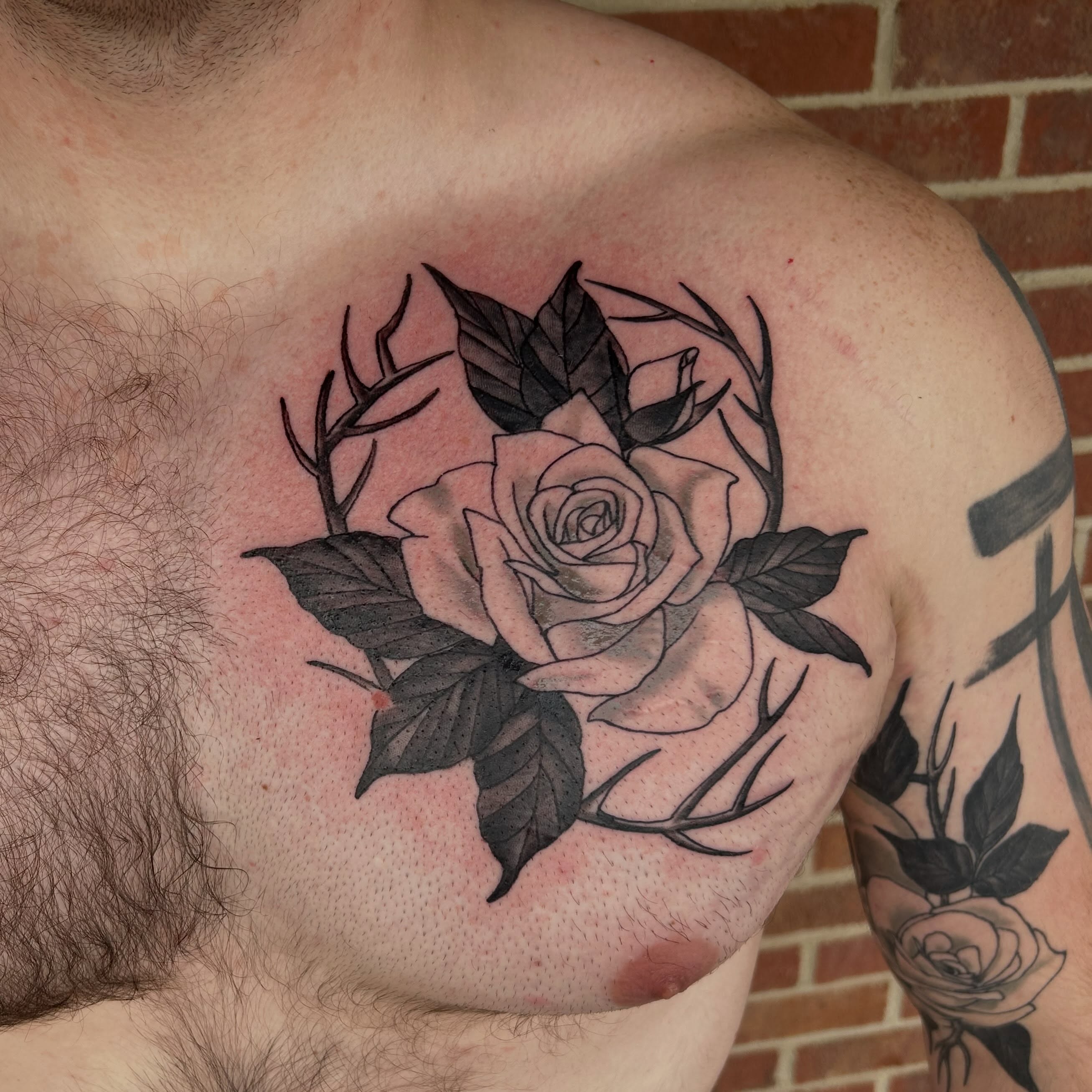 Rose realism tattoo on the chest by Shayna Soderstrom, Columbus, Ohio