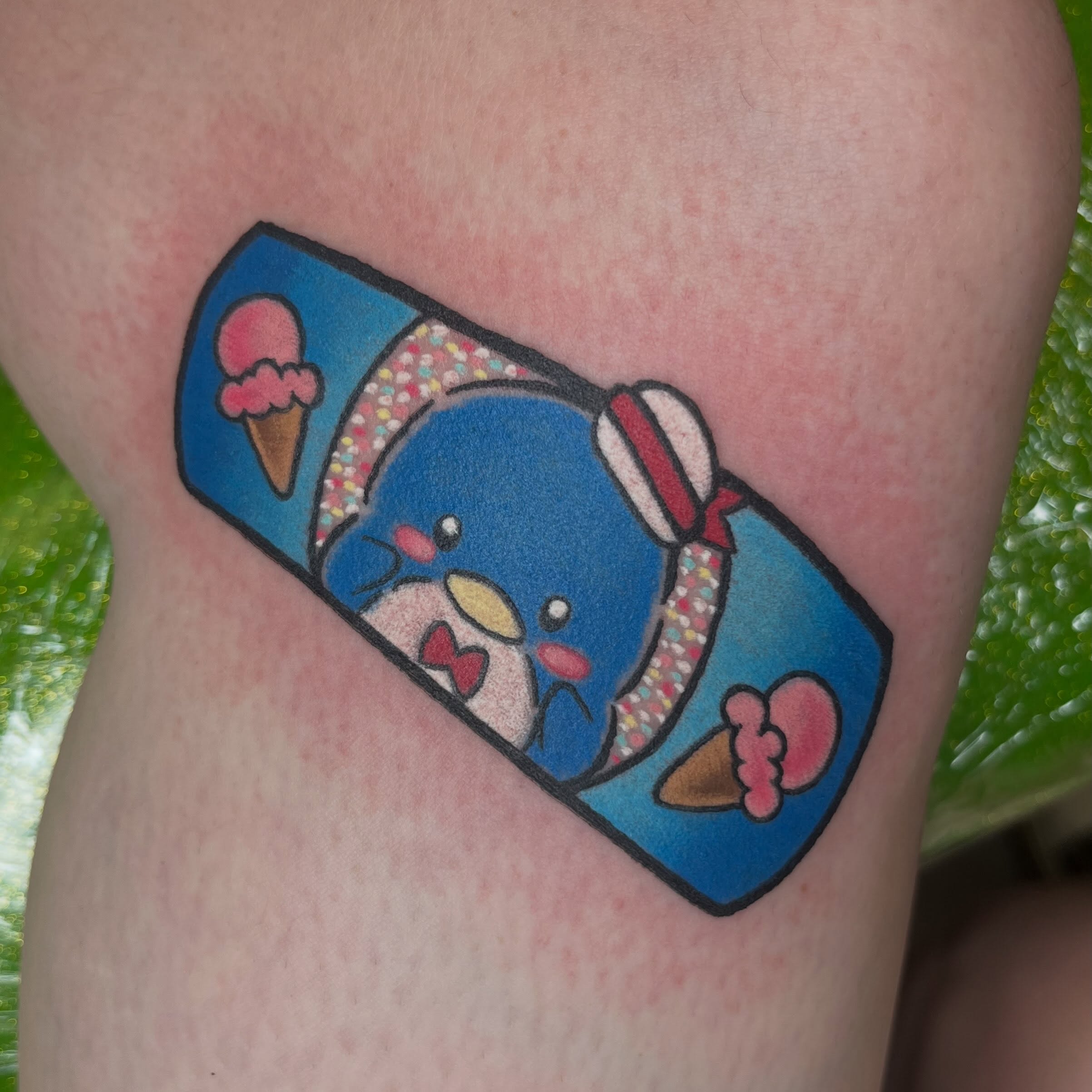 Kawaii character dotwork tattoo on the thigh by Ash Wheeler