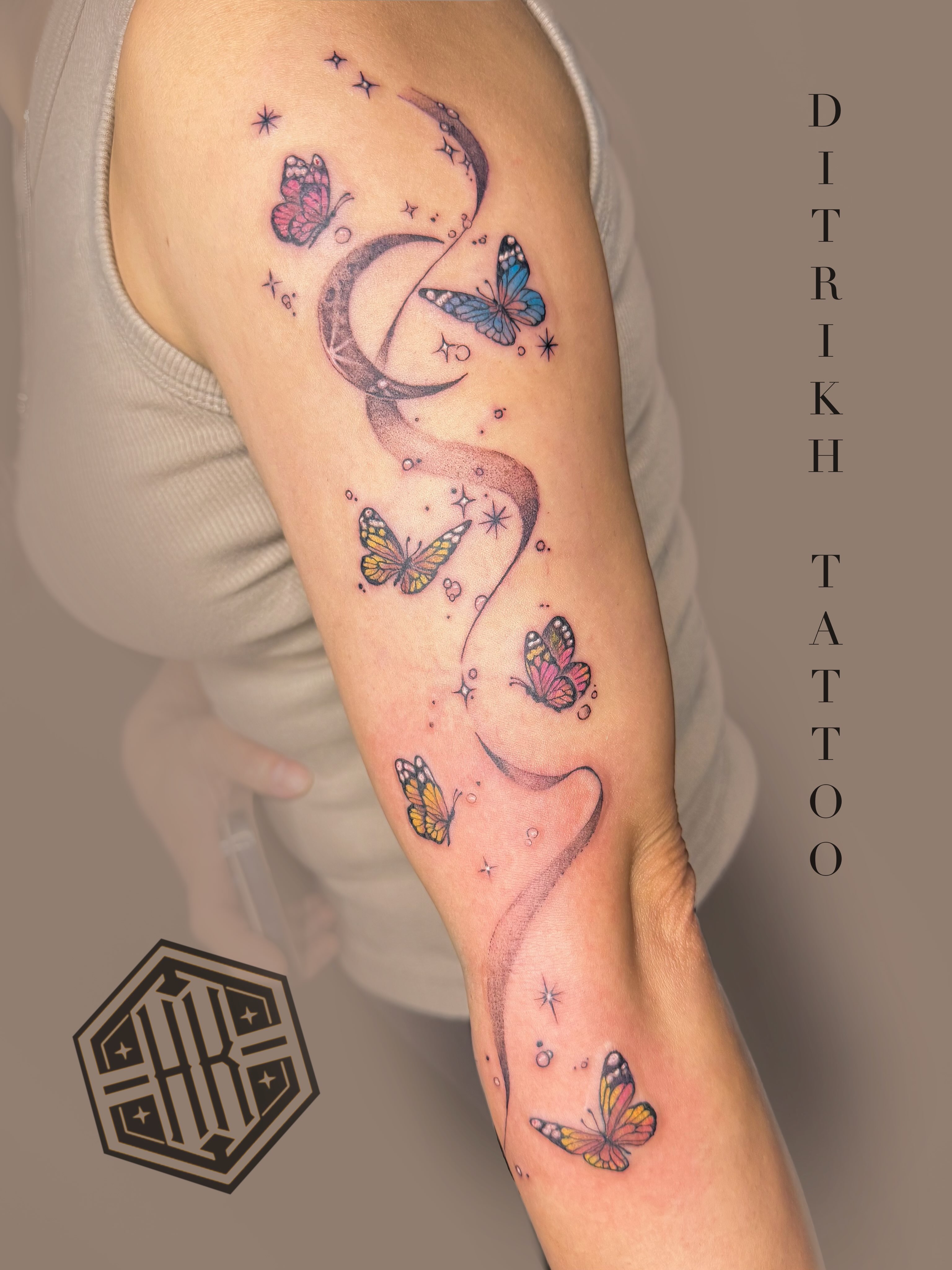 Butterflies and crescent moon dotwork tattoo on the forearm by KET, Calgary, Alberta
