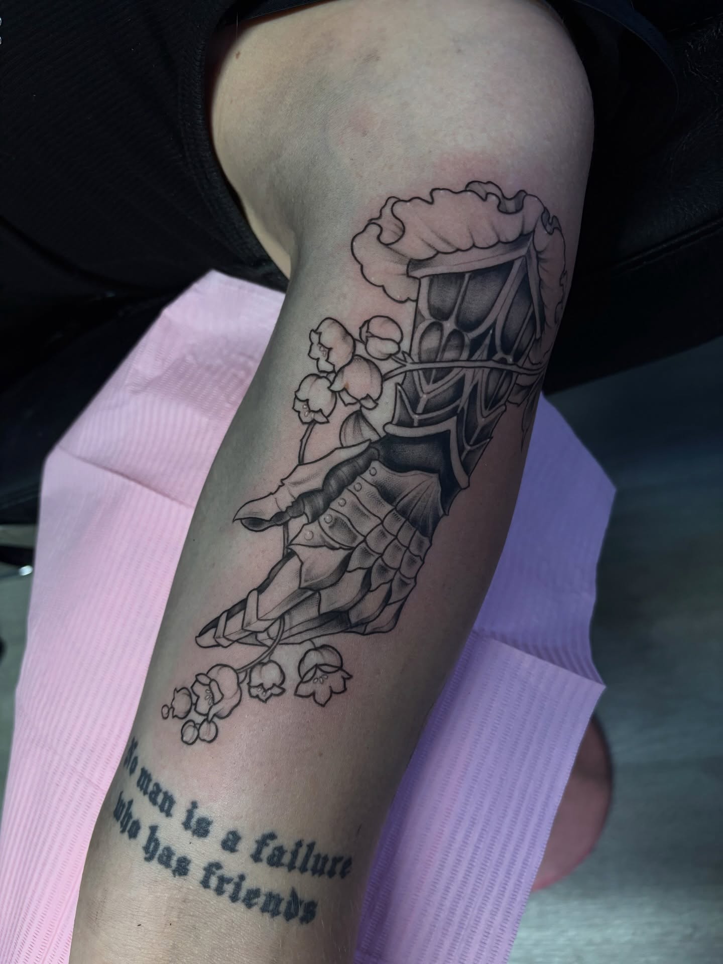 Lily of the valley and knight black and grey tattoo on the forearm by Elixabeth